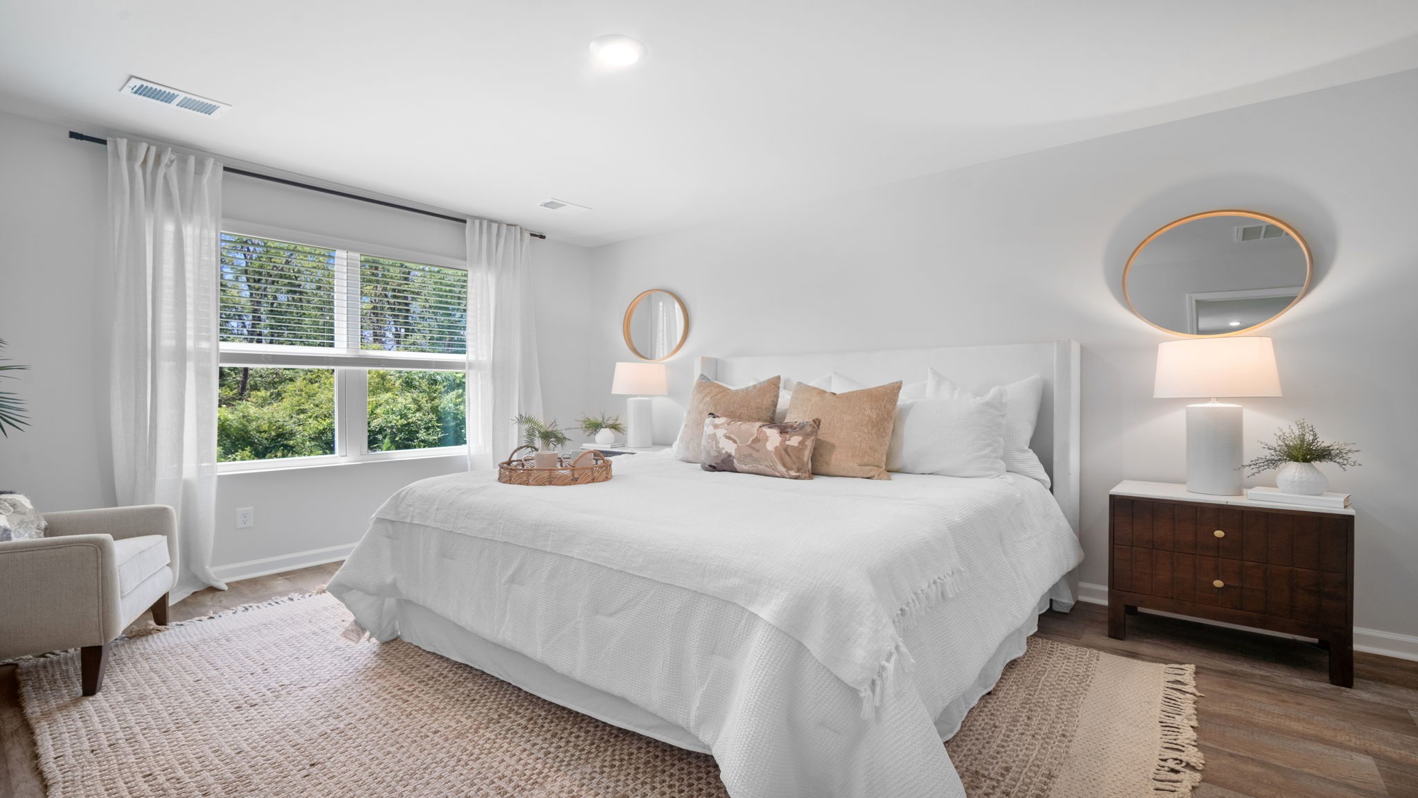 Private primary suite in the Cali floor plan featuring a spacious bedroom, walk-in closet, dual vanities, and a luxurious en-suite bathroom.