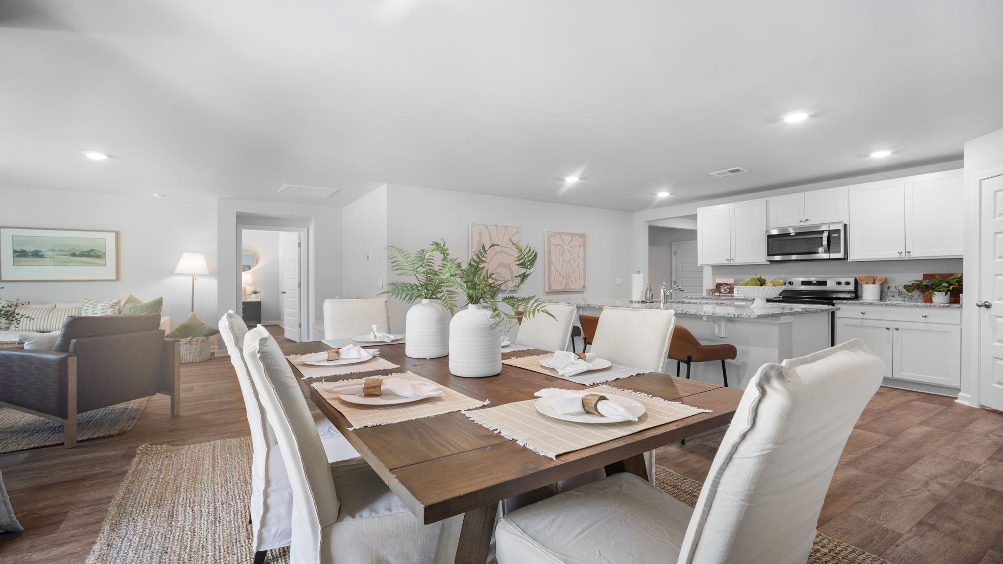 Elegant dining area in the Cali floor plan featuring open sightlines to the kitchen and living room, perfect for family meals and entertaining.