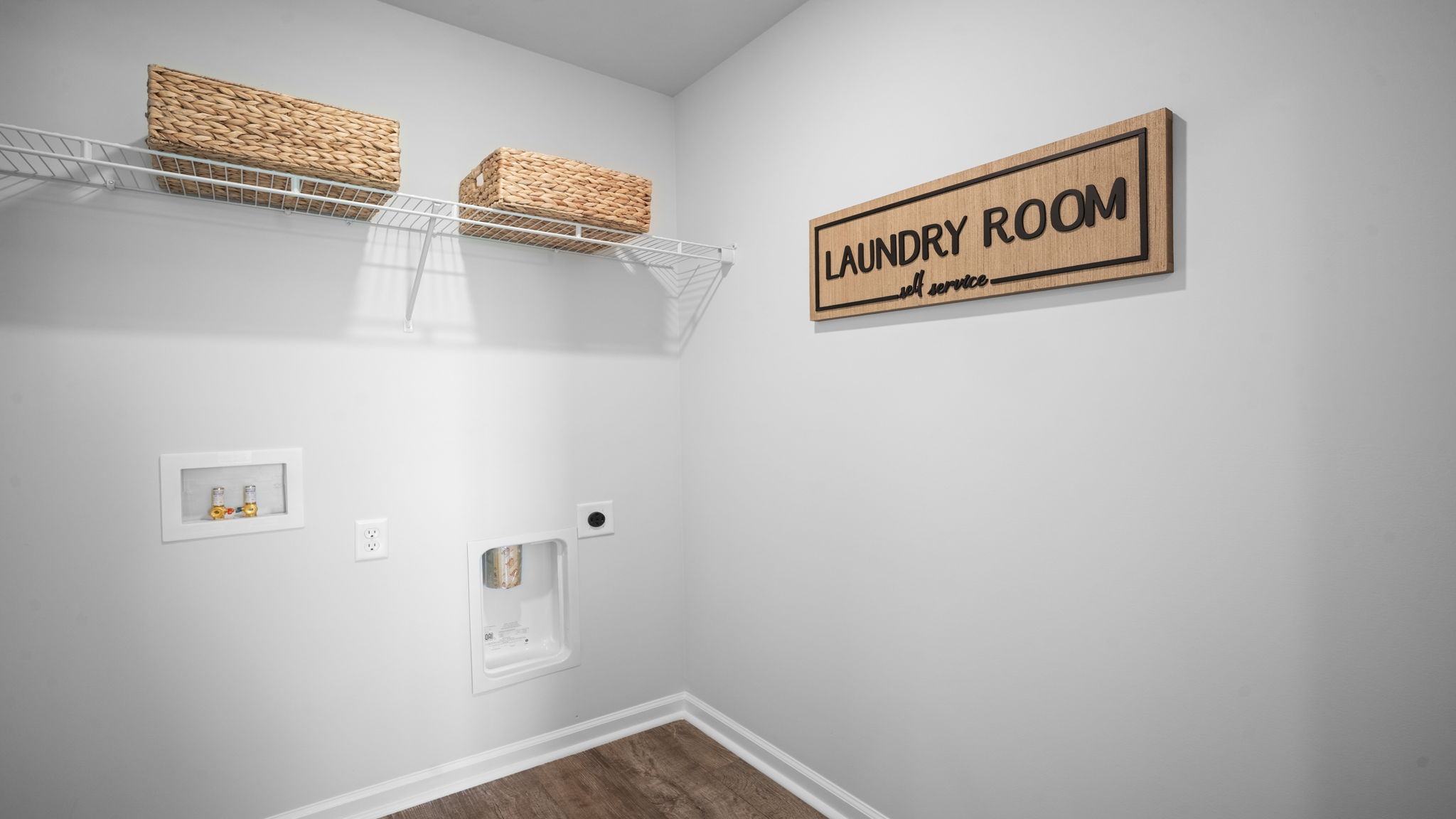 Functional laundry area in the Belhaven home designed for everyday efficiency and organization.