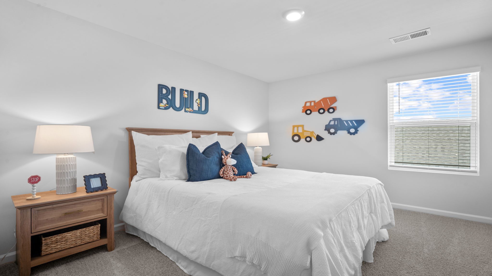 Bright bedroom in the Belhaven floor plan featuring modern finishes and flexible use potential.