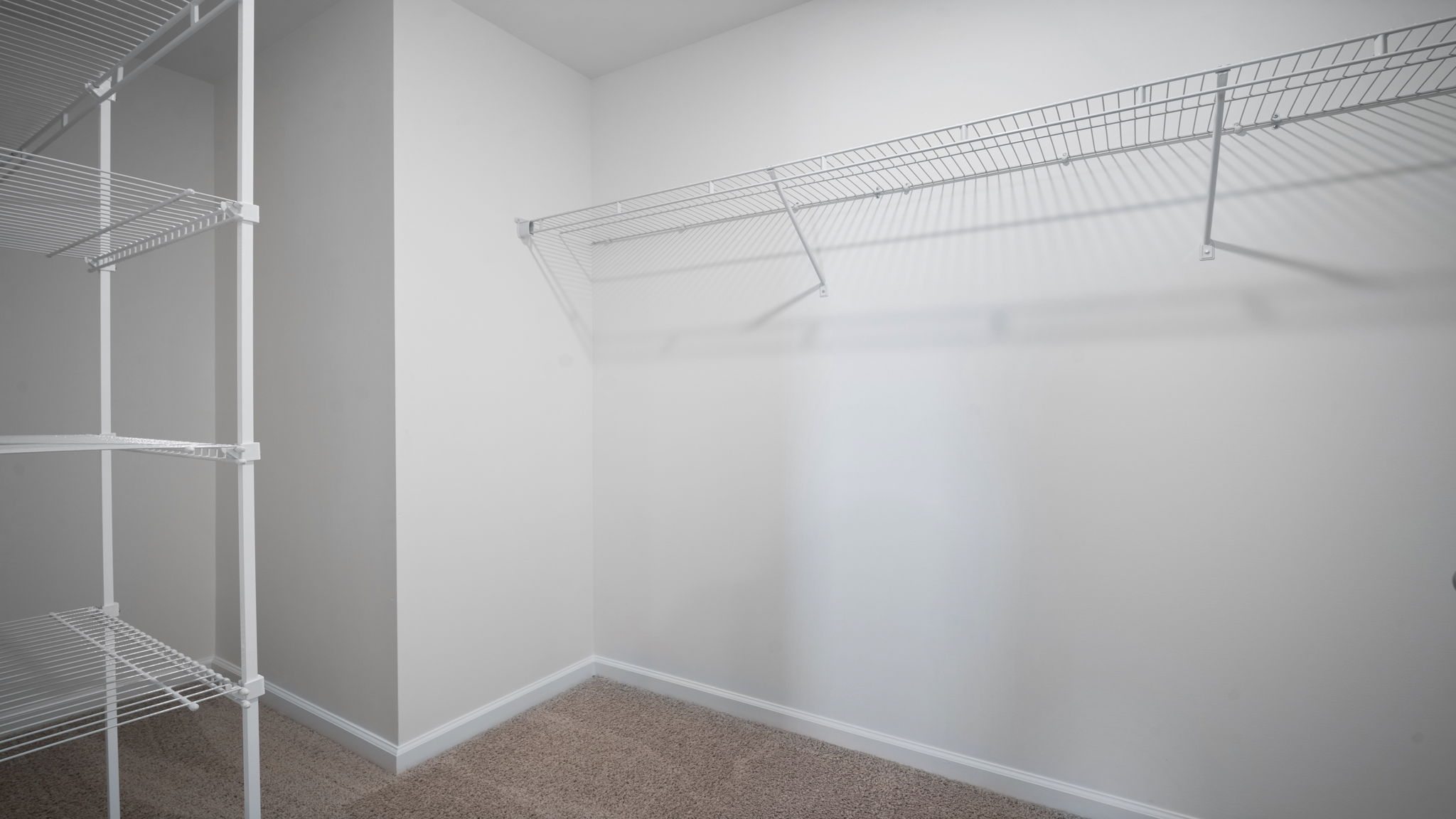Large walk-in closet in the Hayden primary suite featuring ample storage space and thoughtful organization options.