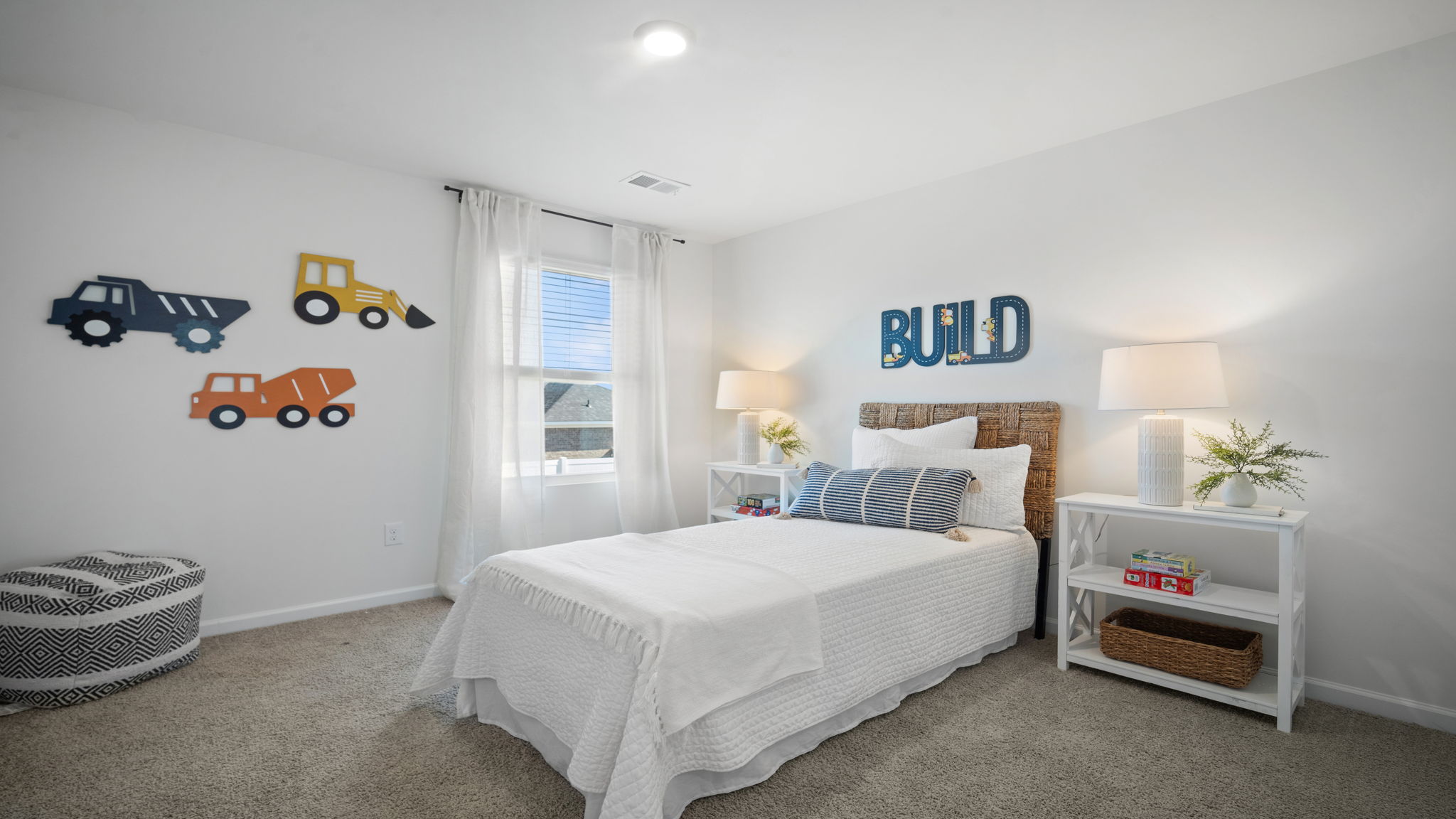 Comfortable guest bedroom in the Hayden floor plan featuring natural light, spacious accommodations, and versatile living options.