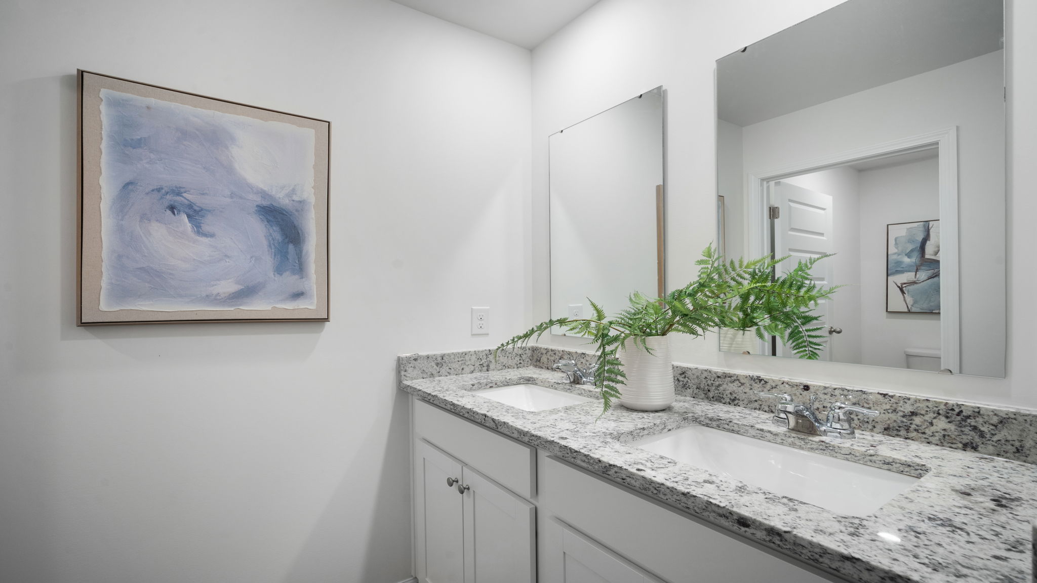 Stylish guest bathroom in the Hayden floor plan featuring contemporary fixtures, vanity storage, and modern finishes.