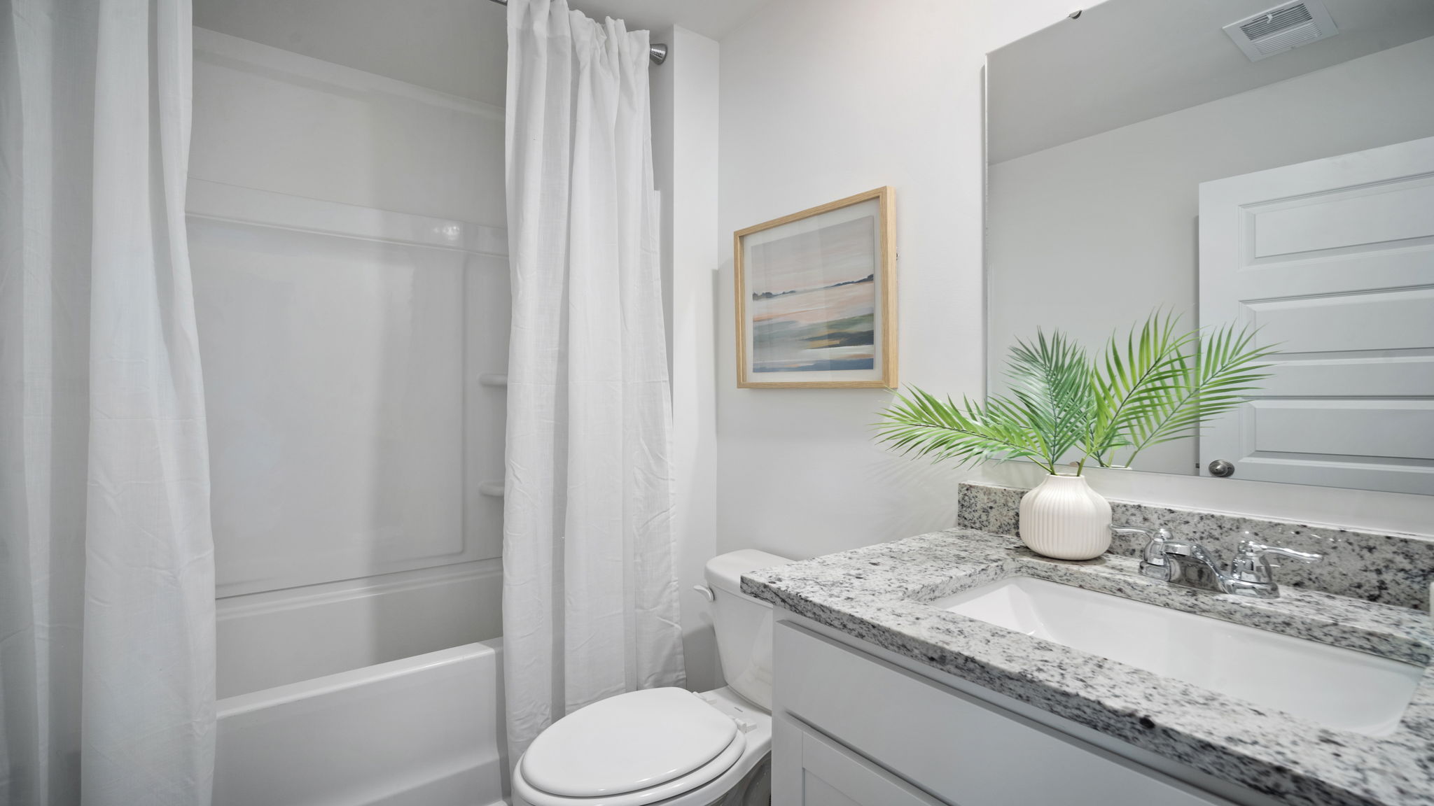 Full secondary bathroom in the Hayden home designed for convenience and comfort for family members and guests.