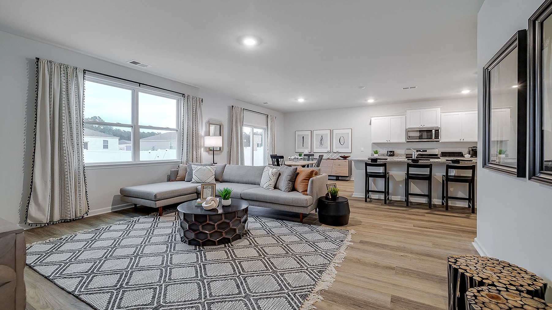 living room looking to dining and kitchen