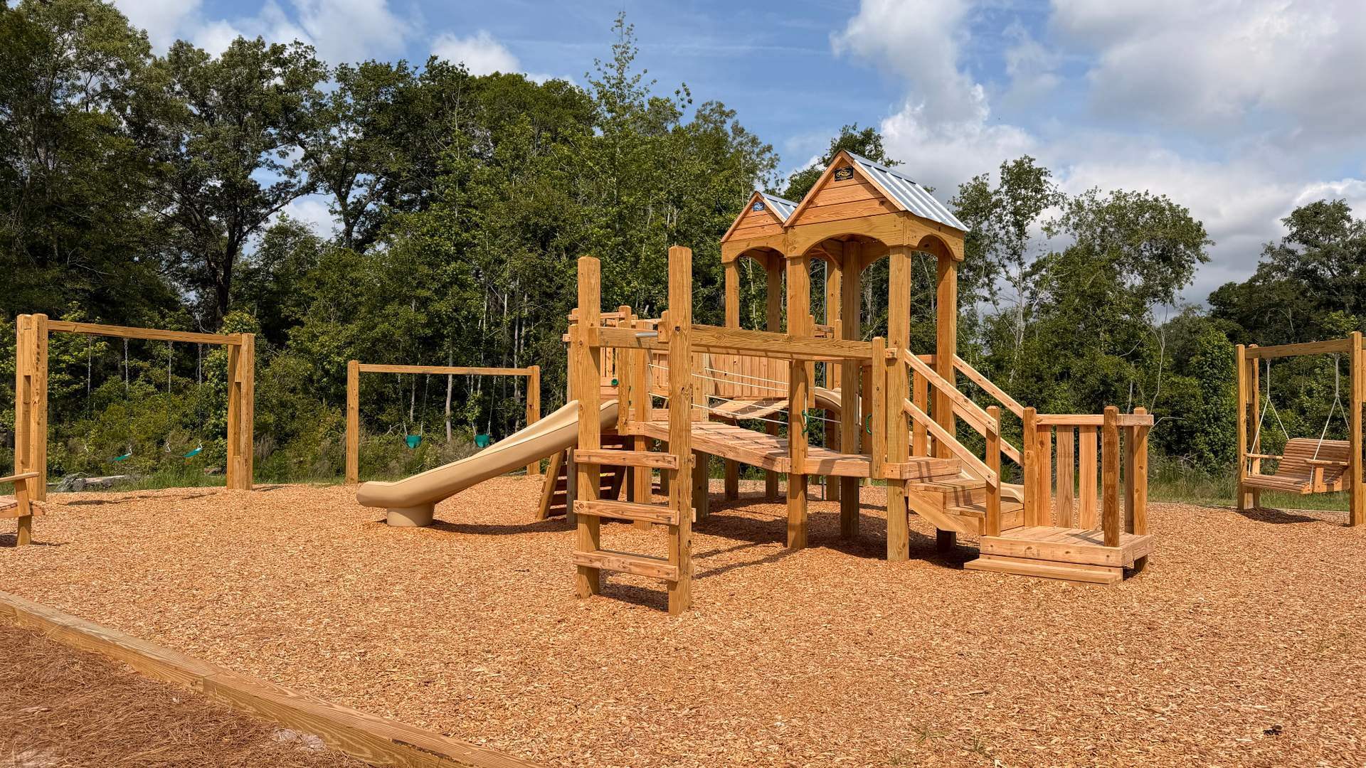 Community playground at Stockyard by D.R. Horton featuring modern play equipment, open green space, and family-friendly outdoor recreation.