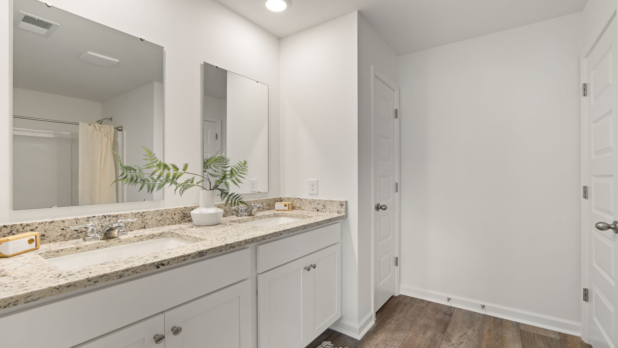 Primary bathroom with dual vanity and modern storage in the Denmark floor plan