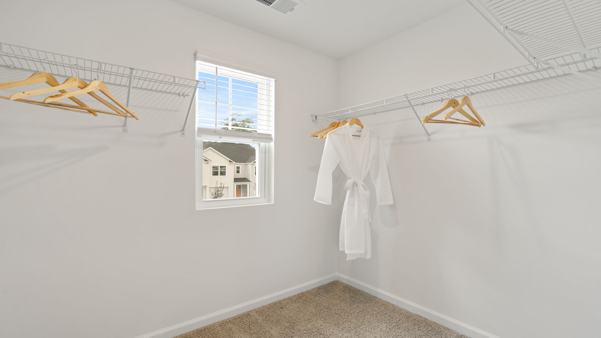 Walk-in closet in the primary suite of the Denmark floor plan