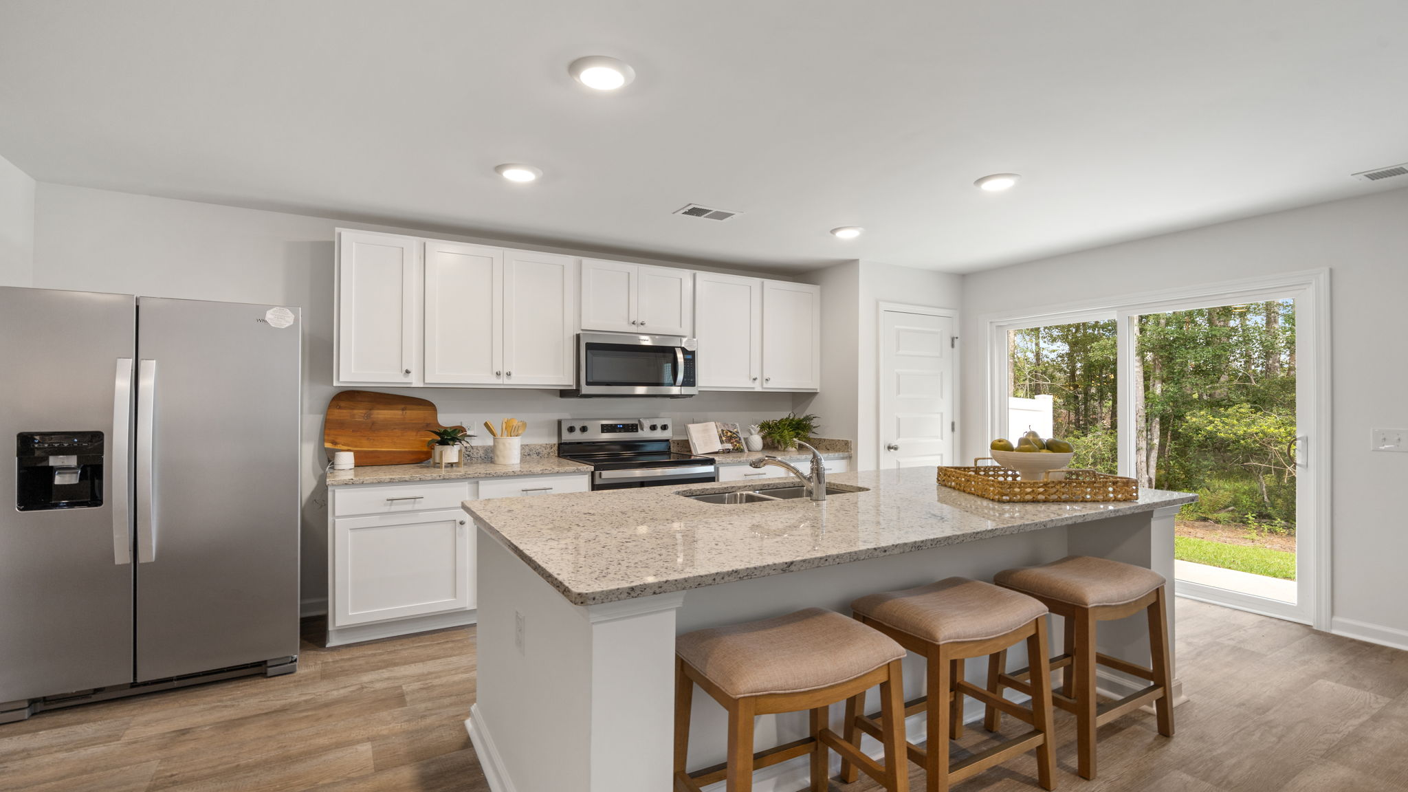 Designer kitchen with large island and abundant cabinet space in the Denmark floor plan