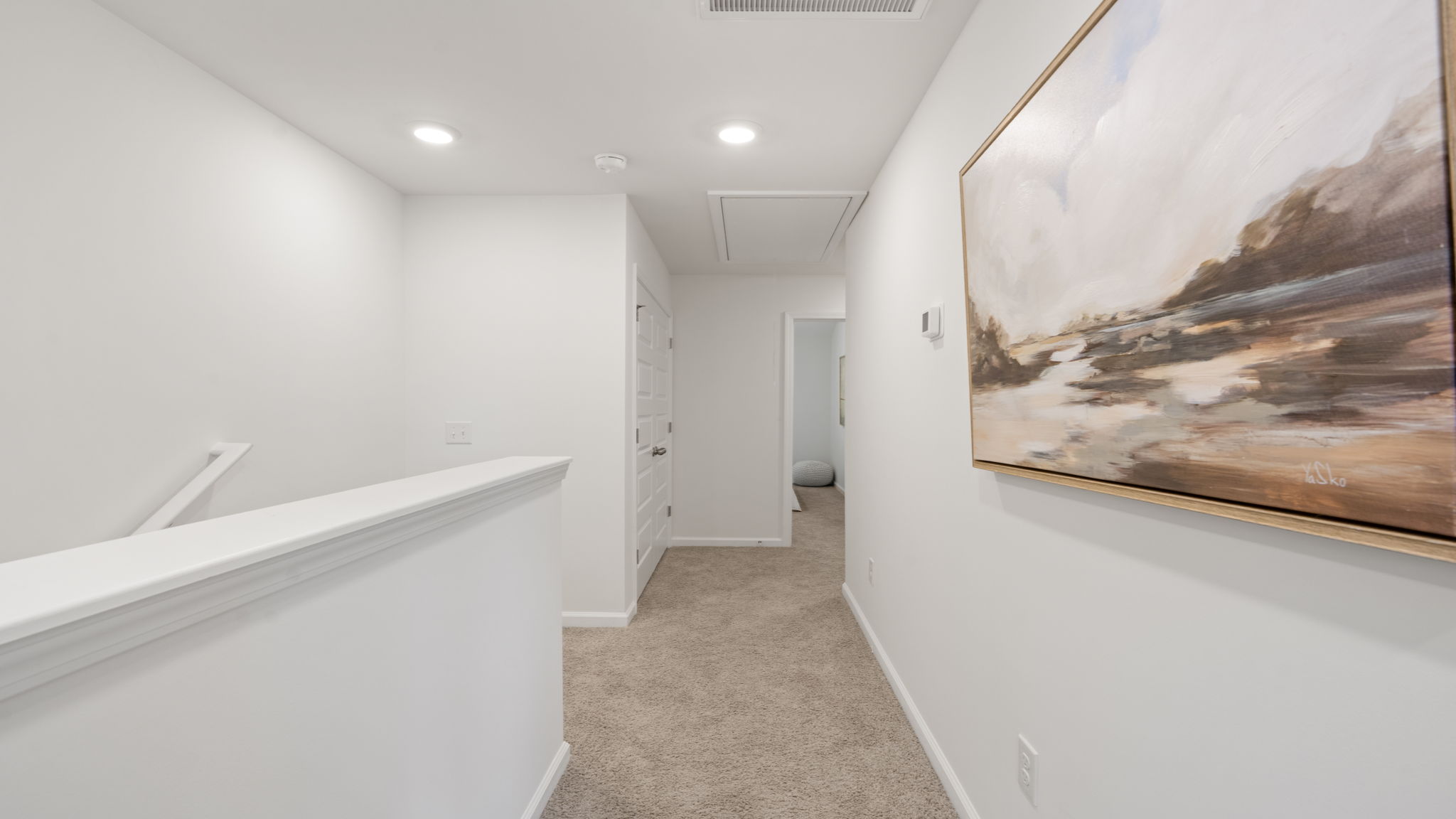 Upstairs hallway connecting bedrooms and living spaces in the Denmark floor plan