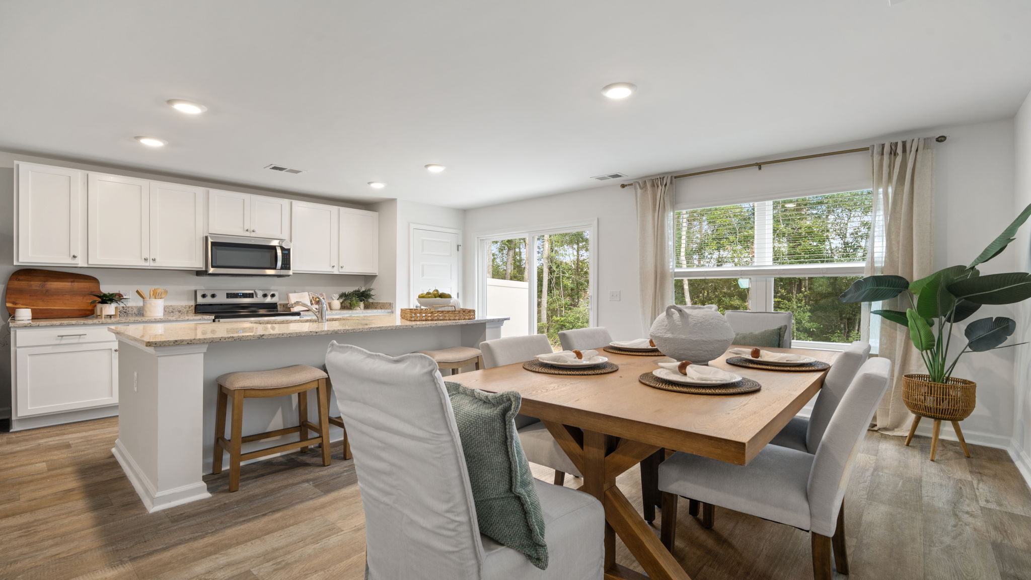 Open-concept layout connecting the kitchen and living room in the Denmark floor plan