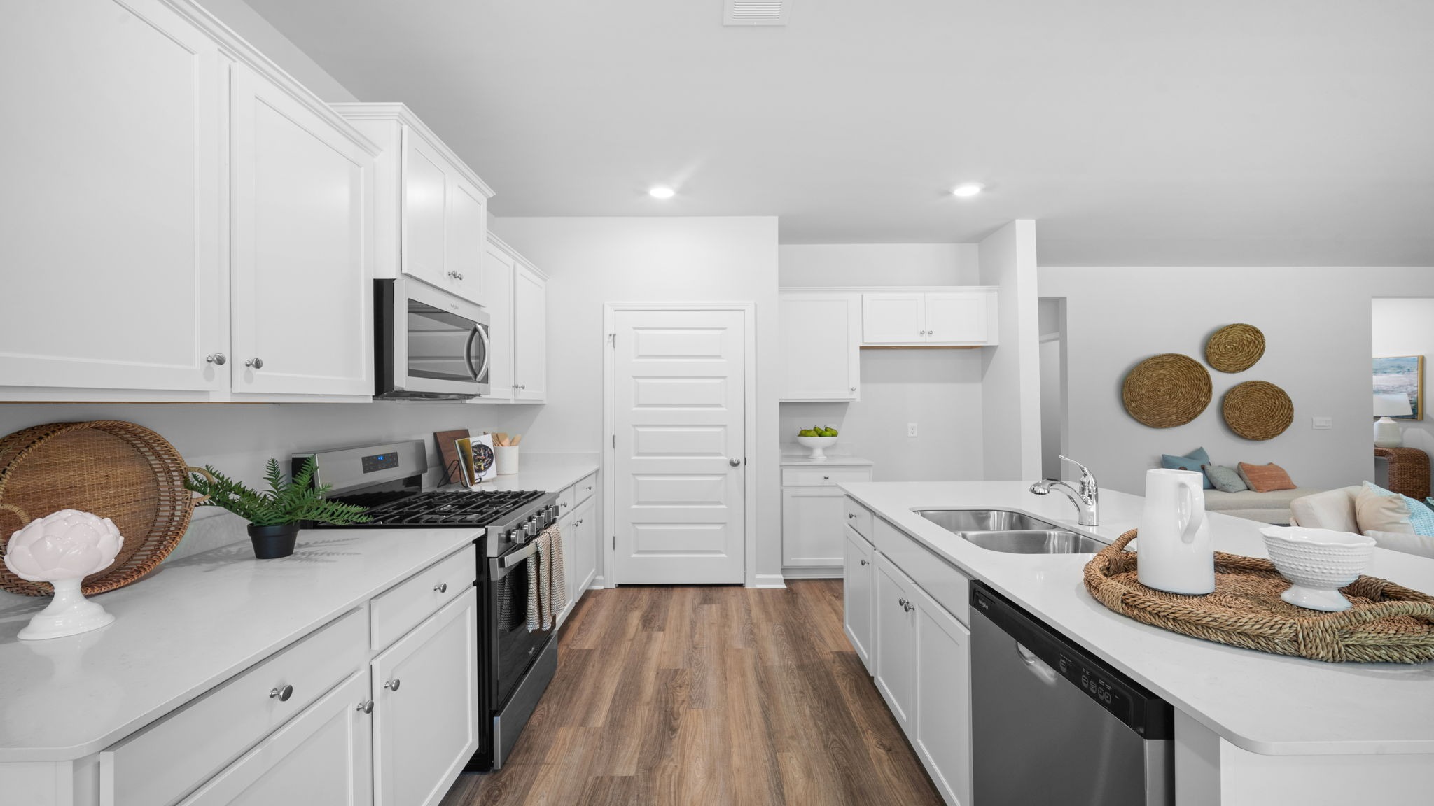Kitchen walkway with counters on both sides