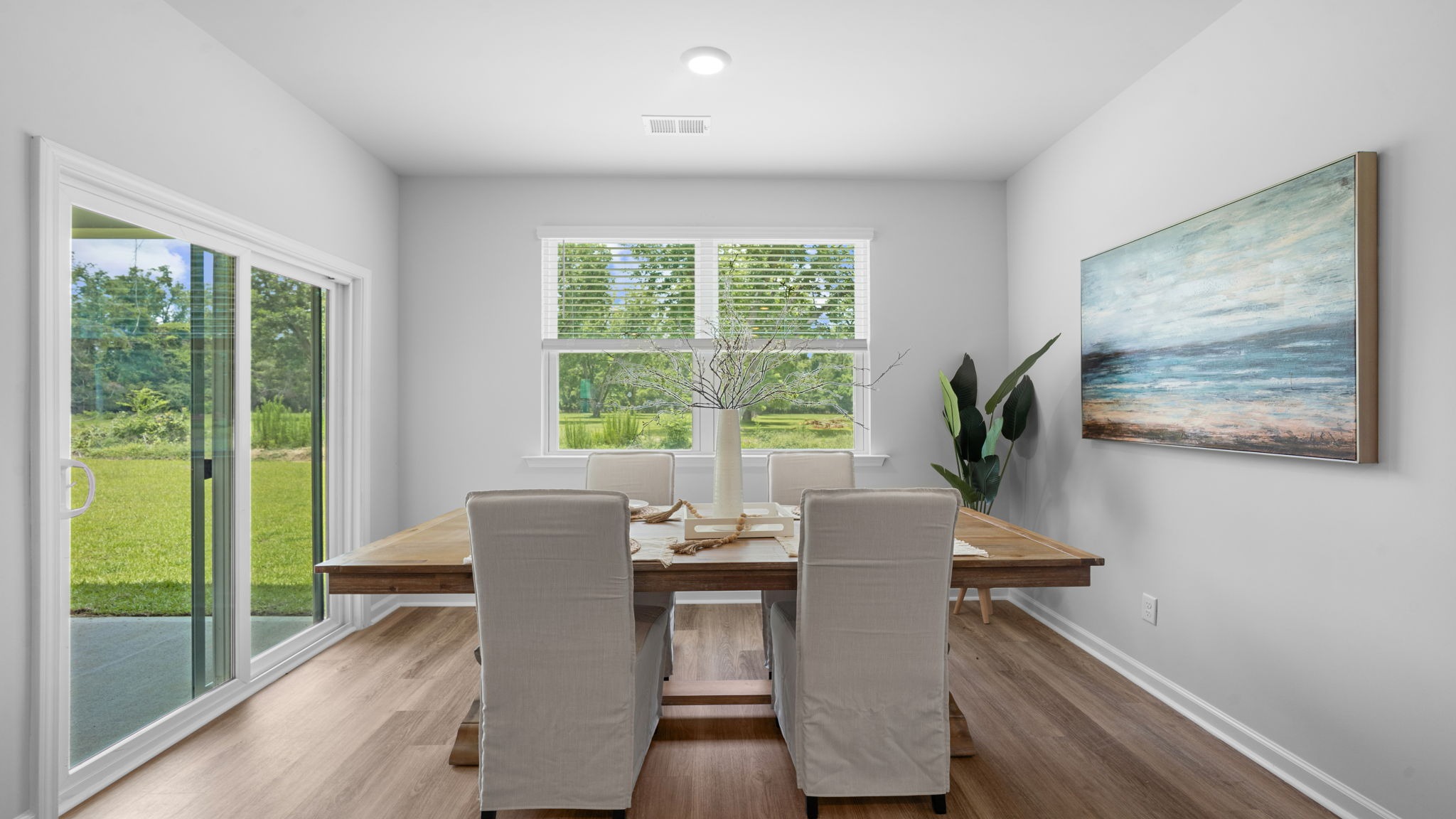 Bright dining area adjacent to kitchen and living spaces, ideal for family meals and entertaining guests.