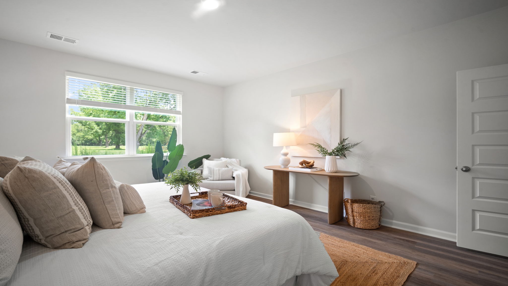 Luxurious owner's bedroom featuring abundant natural light and comfortable design.