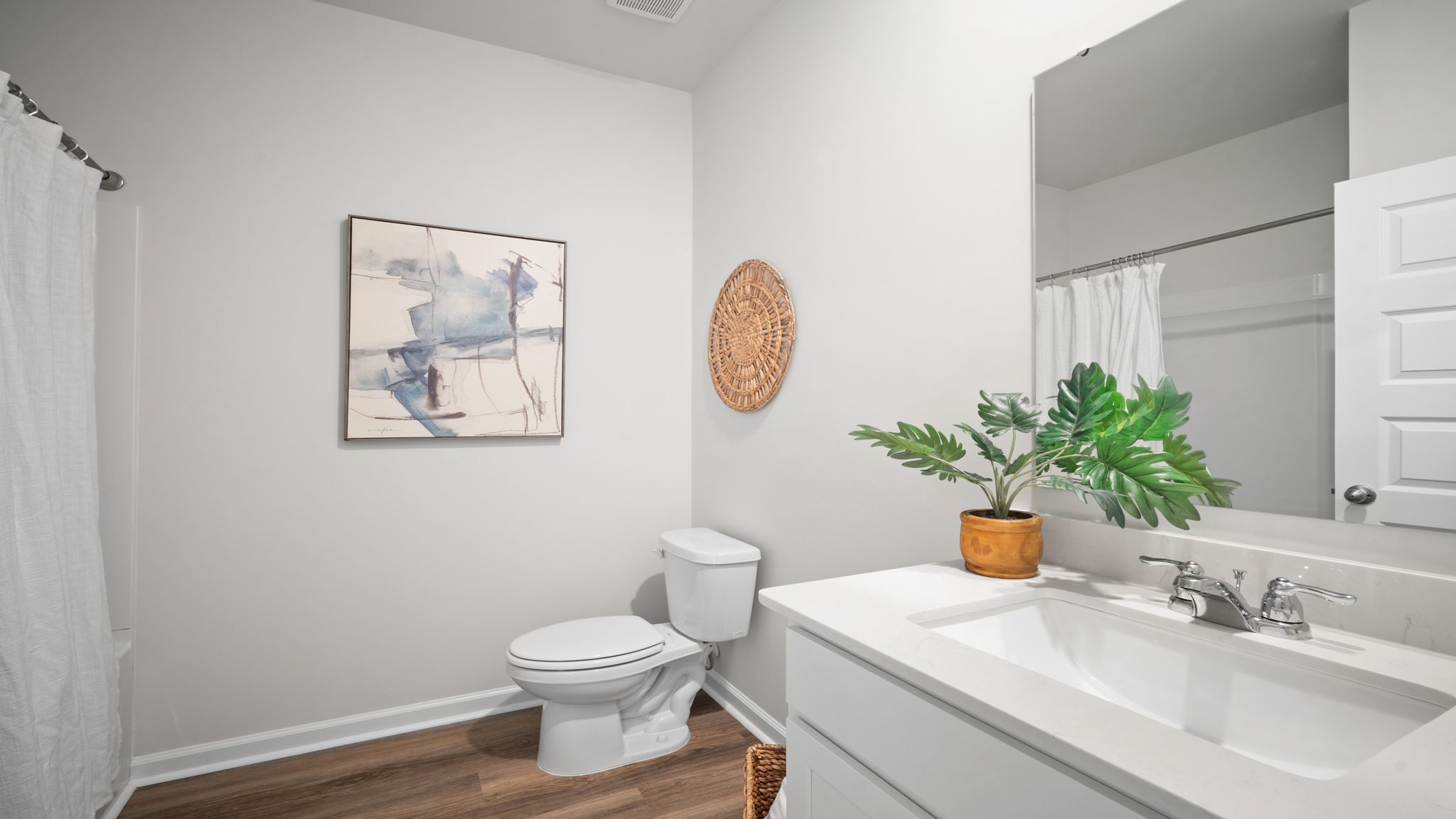 Stylish hall bath designed for family living and guest comfort.