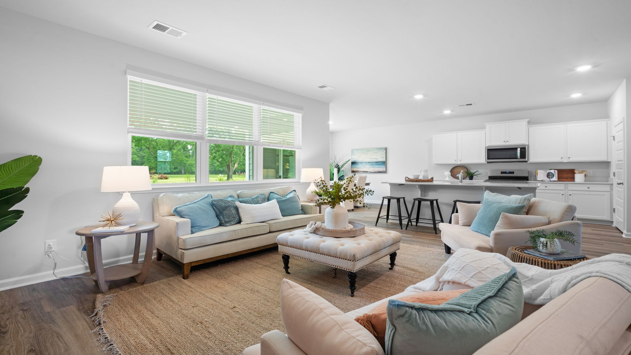 Expansive great room seamlessly connected to kitchen and dining areas.