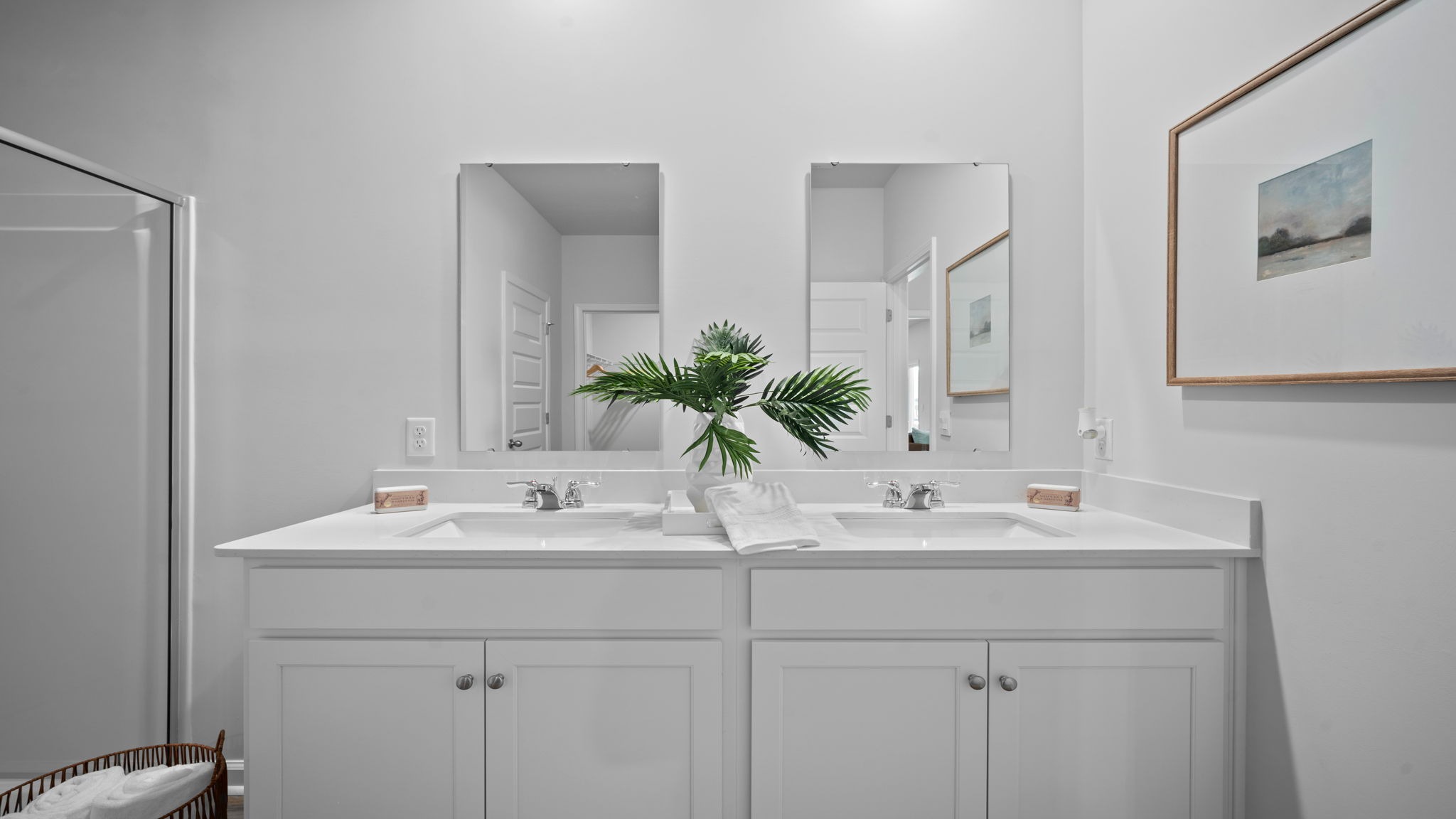 Primary bathroom with a stand-up shower and double vanities