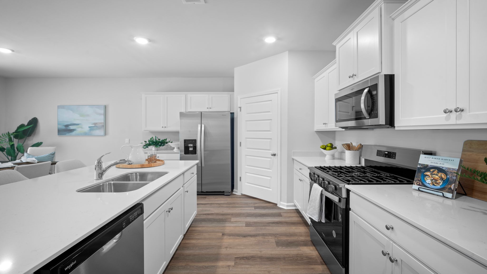 Kitchen walkway with counters on both sides
