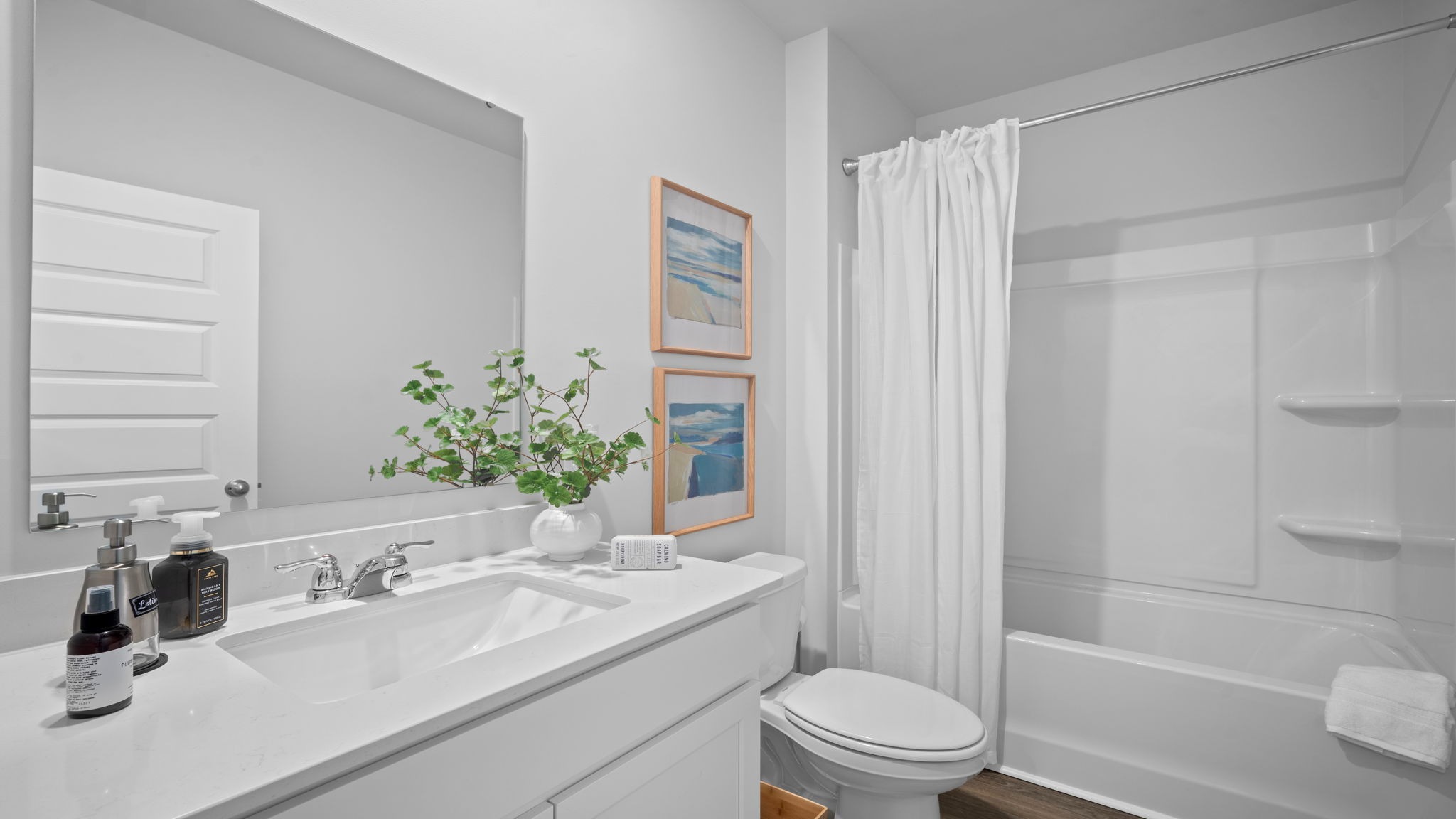 Guest bathroom serving secondary bedrooms in the Cali floor plan