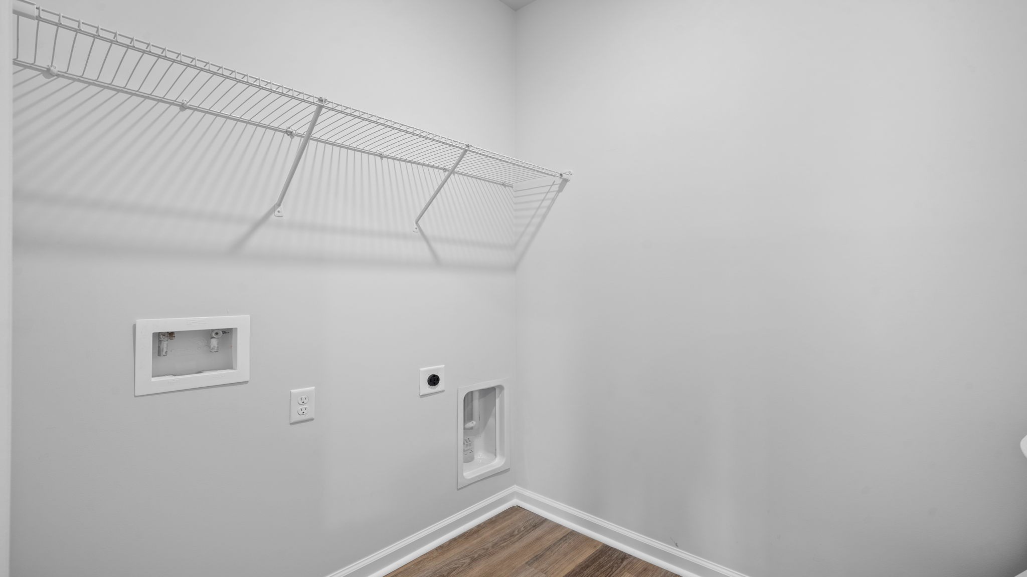 Convenient laundry room in the Cali floor plan by D.R. Horton