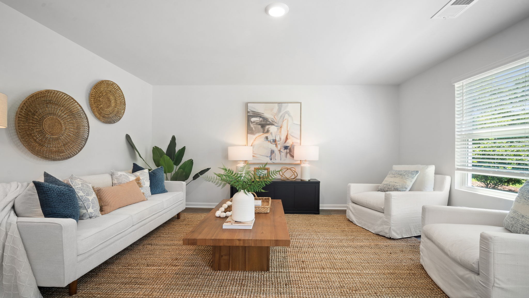 Open-concept family room in the Belhaven floor plan showcasing spacious gathering areas ideal for entertaining and everyday living.