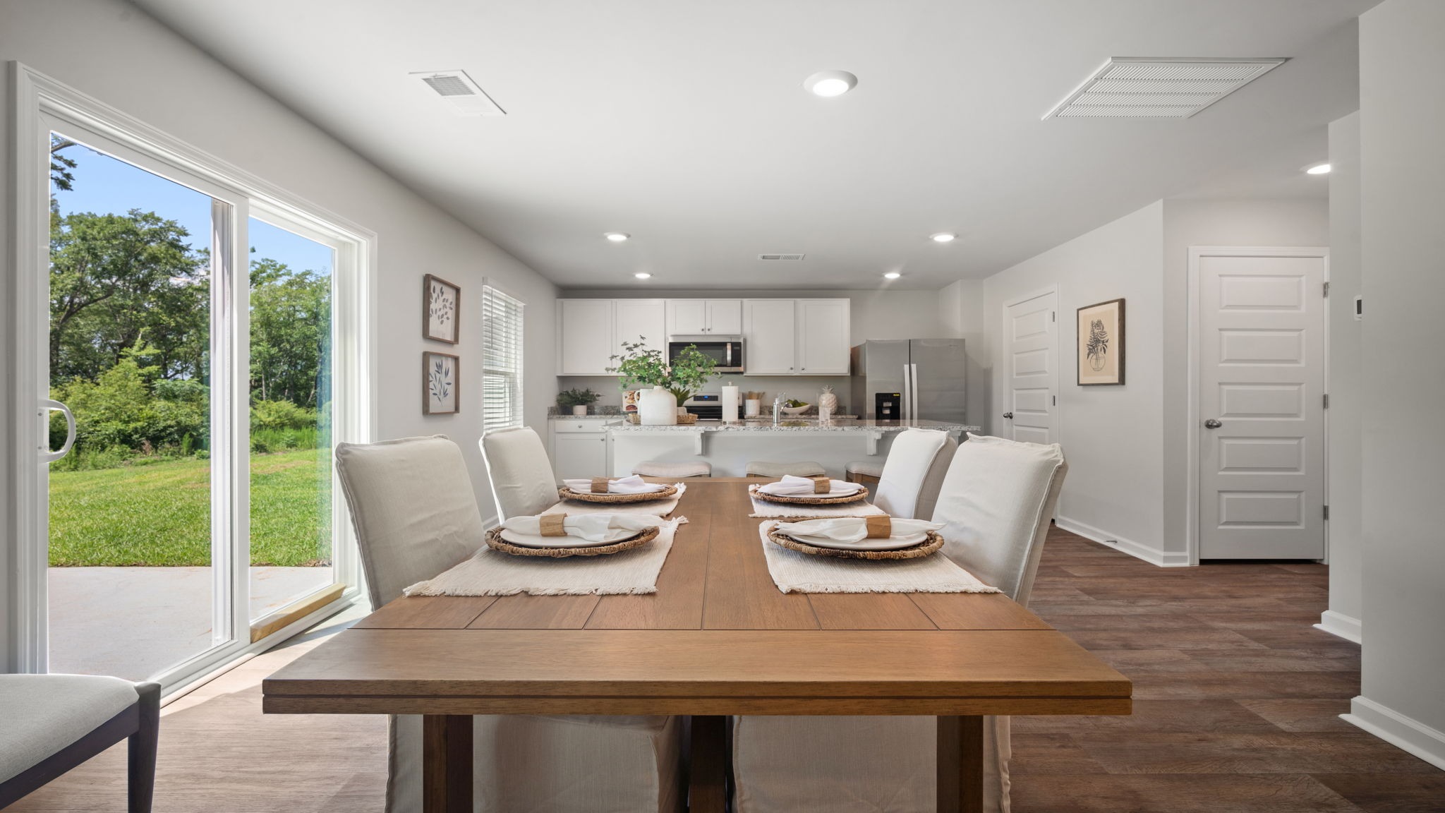 Bright dining area in the Belhaven floor plan connected to the kitchen and living room for effortless entertaining.