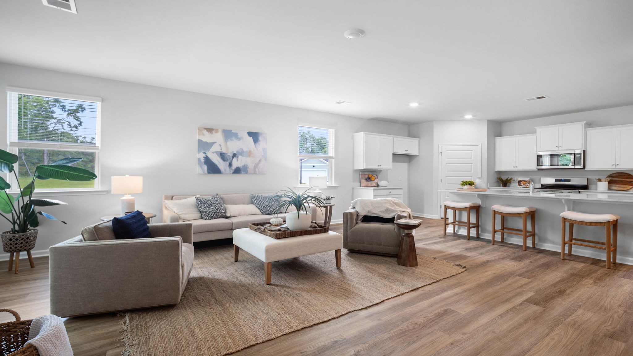 Living area of home decorated with seating