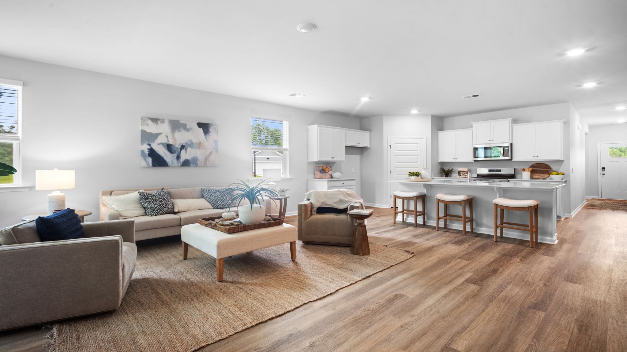 Living area of home decorated with seating