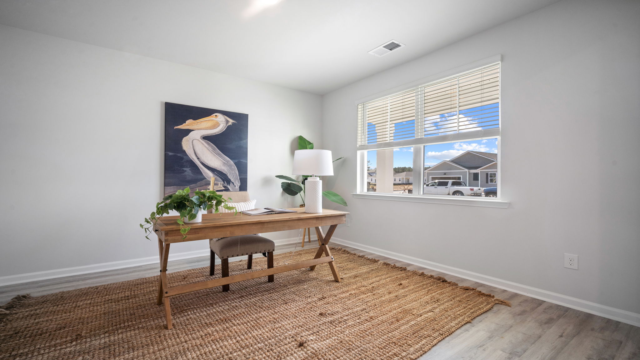 Flexible office area with natural light and room for multiple workstations.