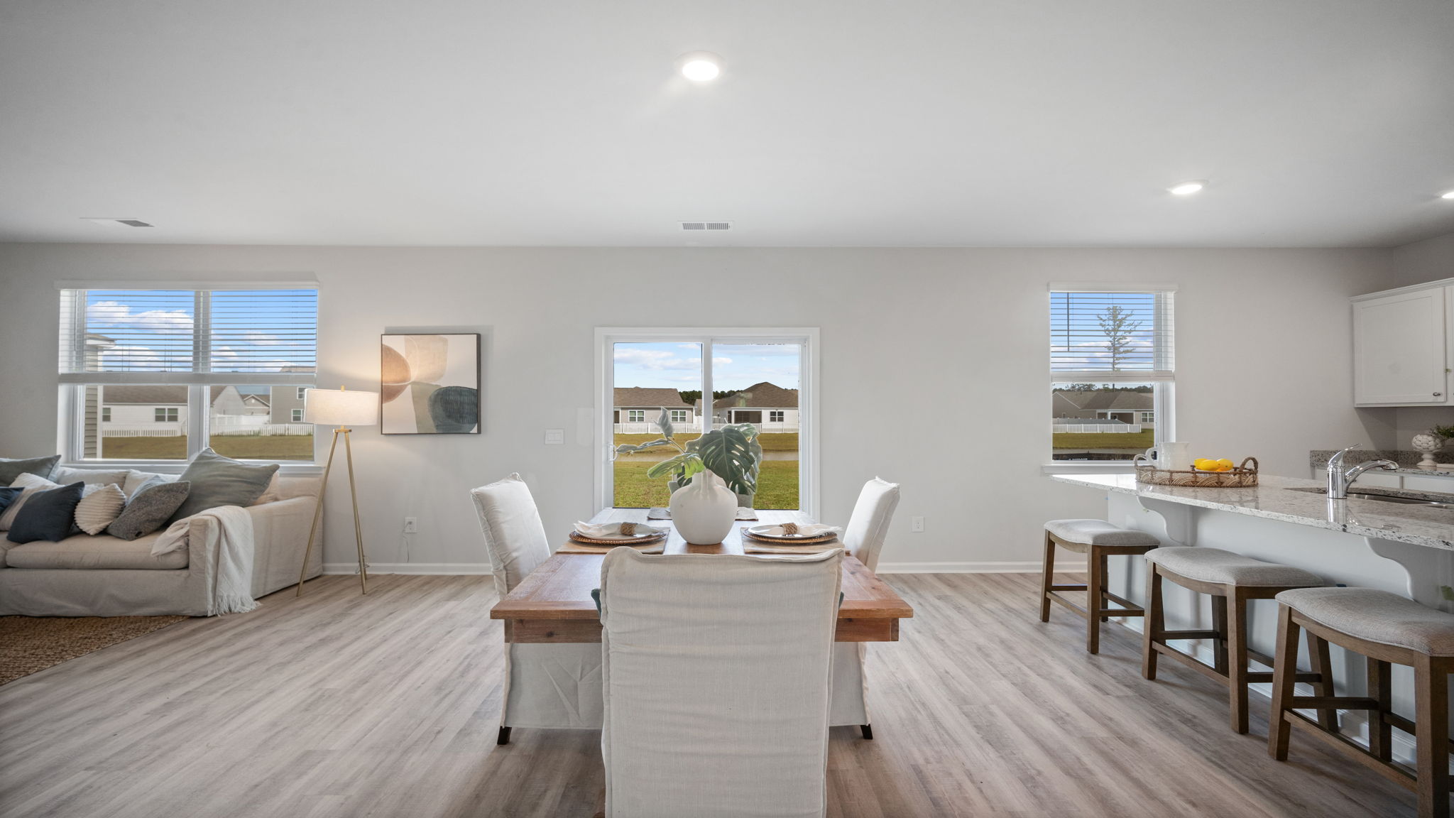 Open dining area conveniently located between the kitchen and family room.
