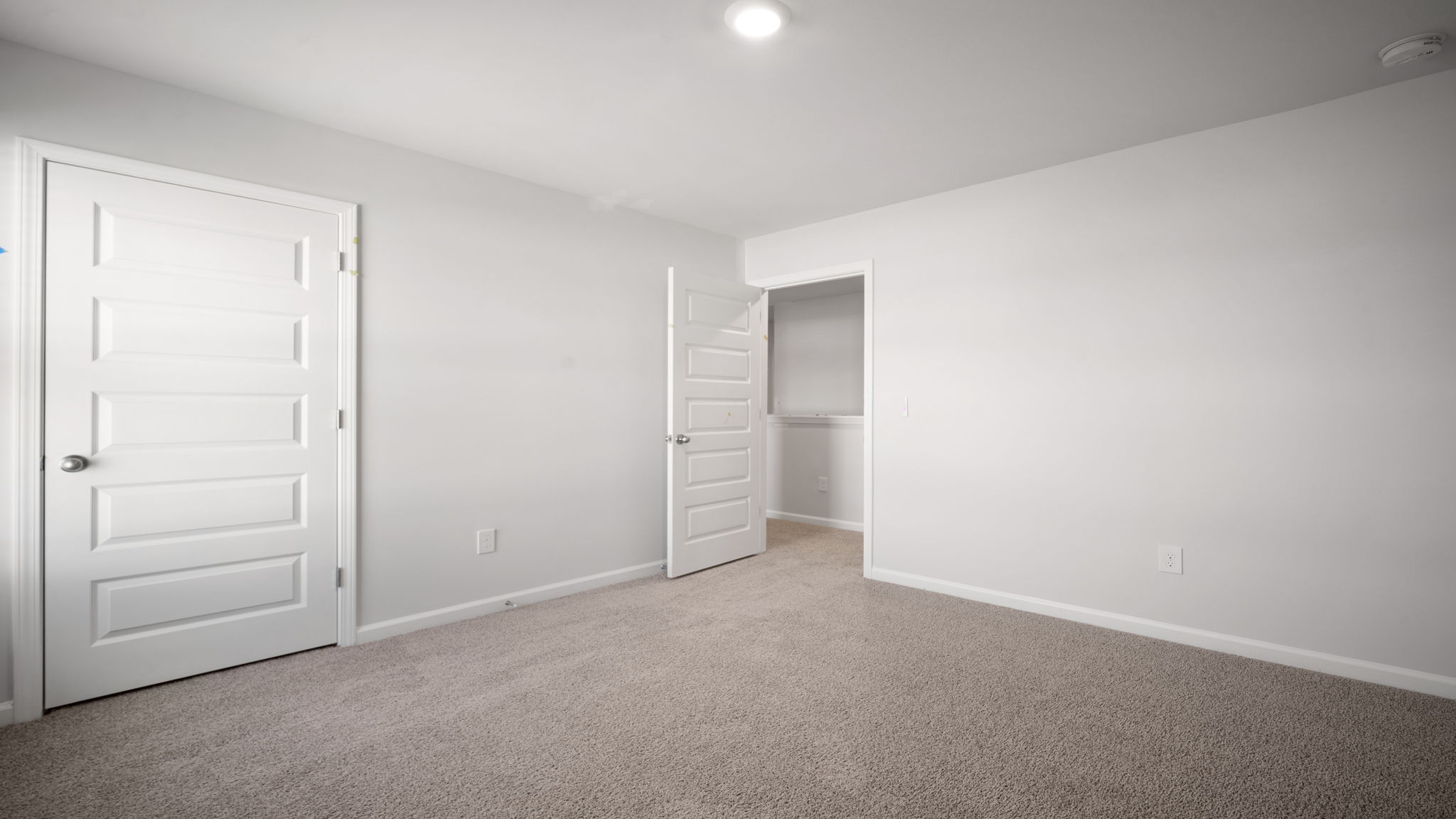 Spacious bedroom offering flexibility for growing families.