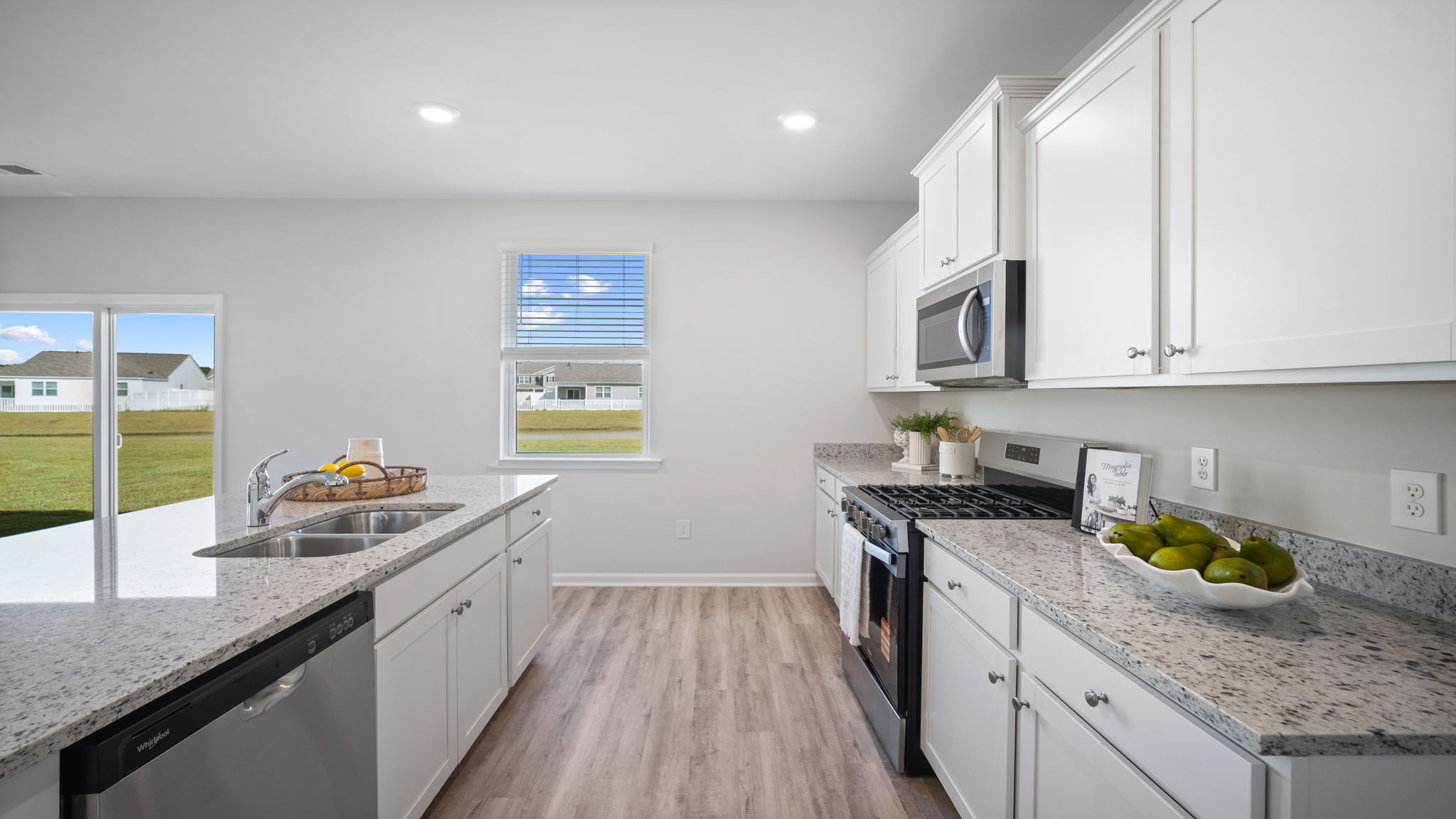 Open kitchen with center island, abundant storage, and entertaining space in the Galen home plan.