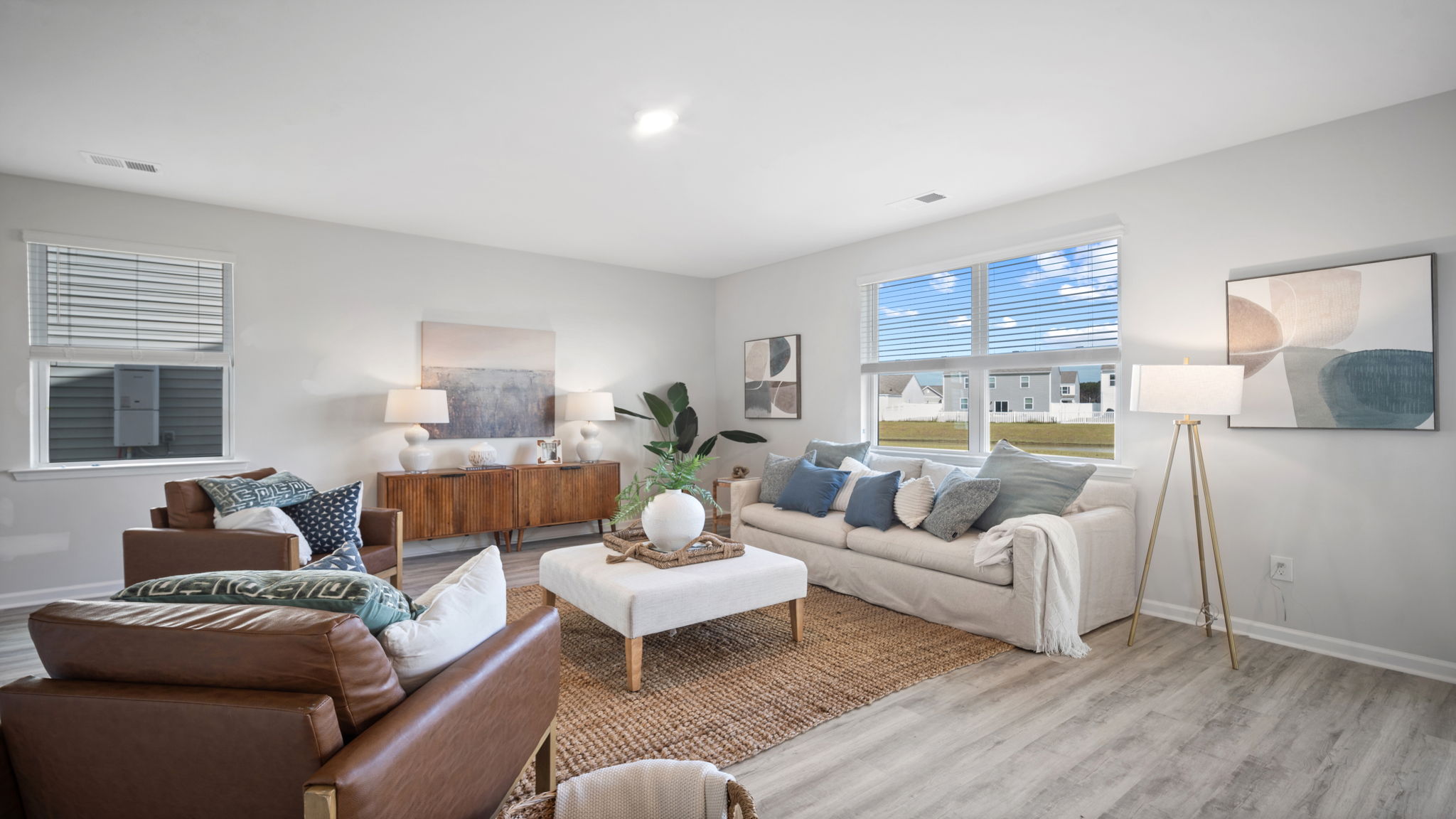 Large great room connecting kitchen and dining spaces in the D.R. Horton Galen floor plan.
