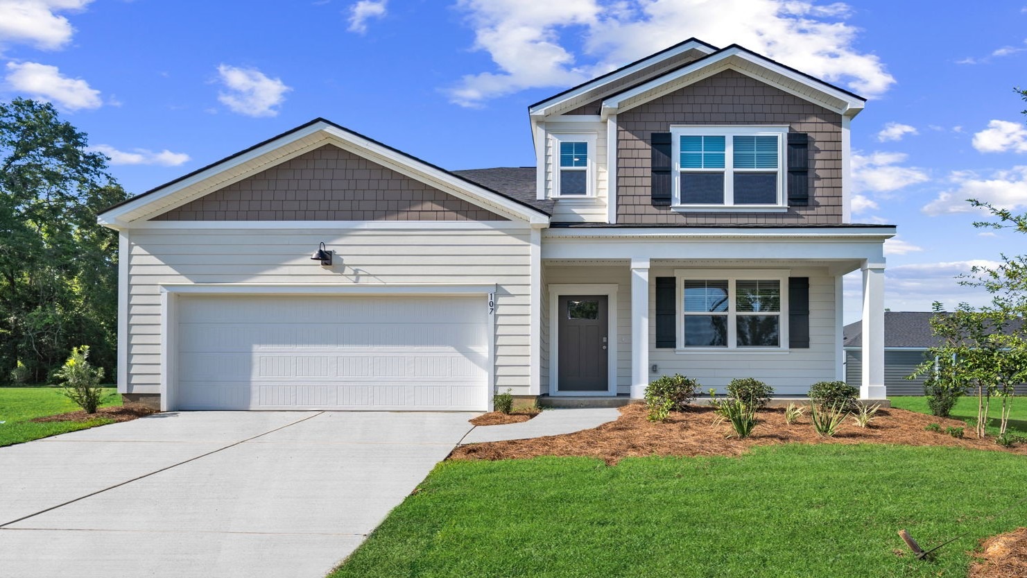 Stunning Salem floor plan home featuring exceptional curb appeal, modern exterior finishes, a spacious two-car garage, and professionally landscaped grounds.