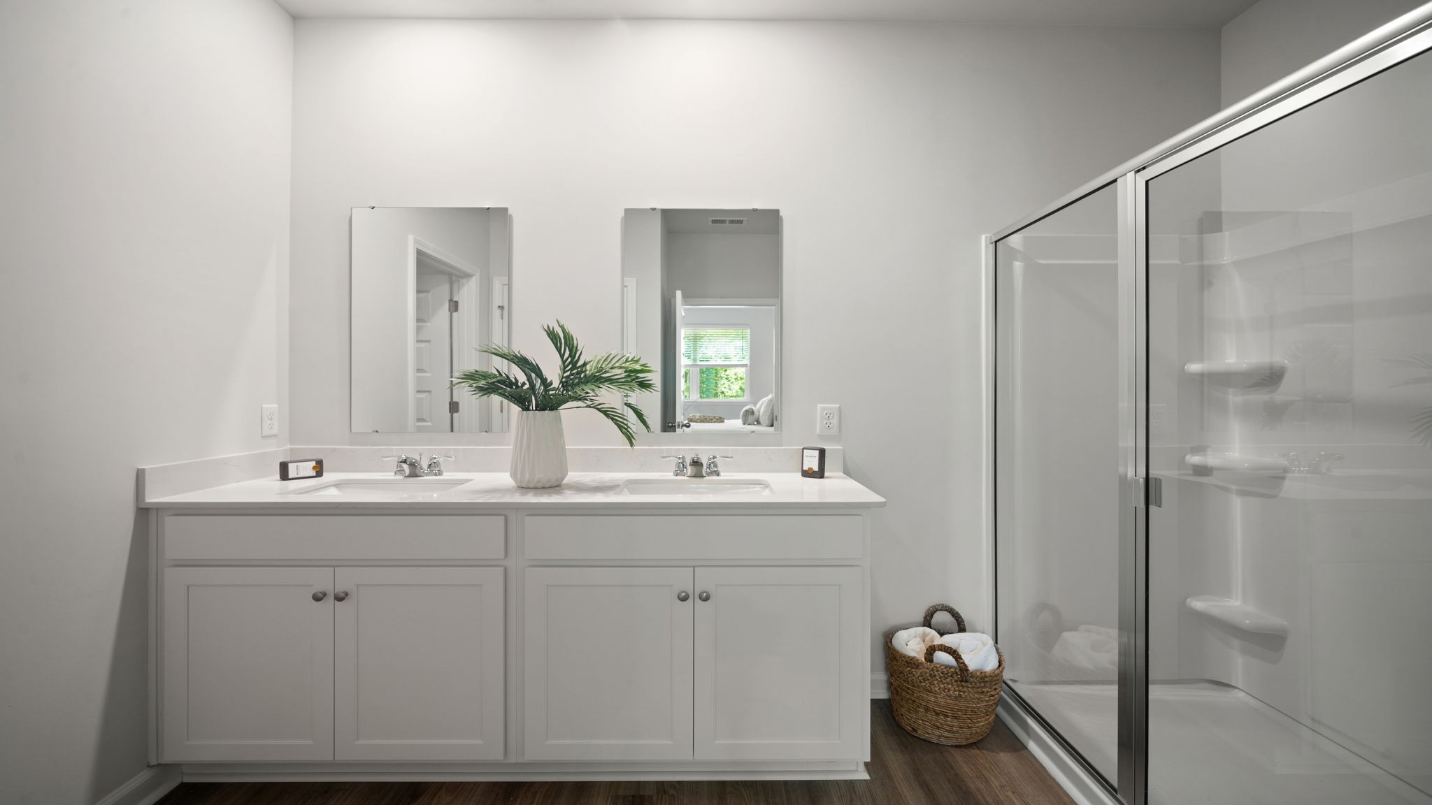 Beautiful owner's bath offering generous counter space, contemporary fixtures, and luxurious comfort.