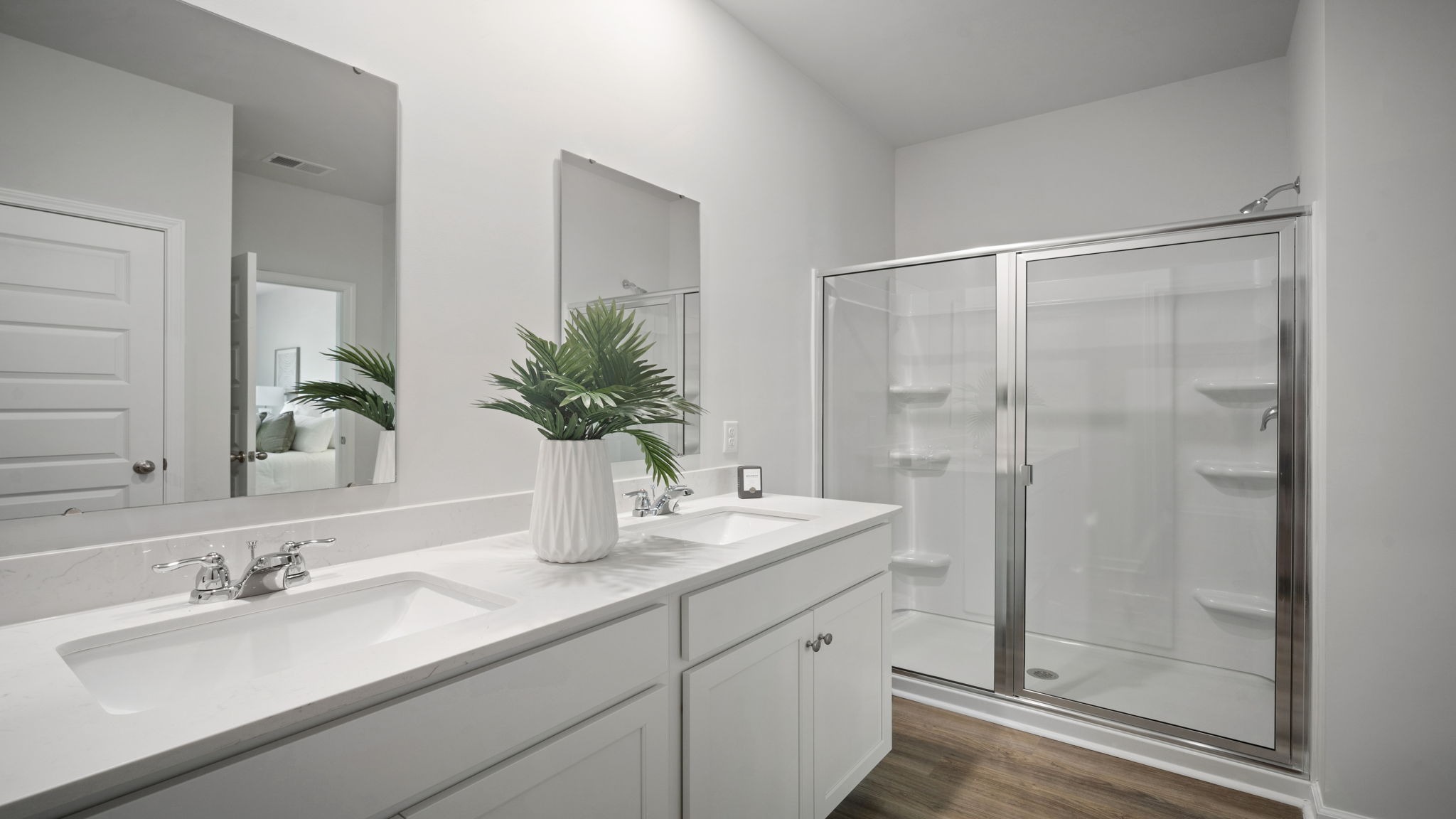 Well-appointed primary bathroom designed as a private retreat with stylish finishes and functional storage solutions.