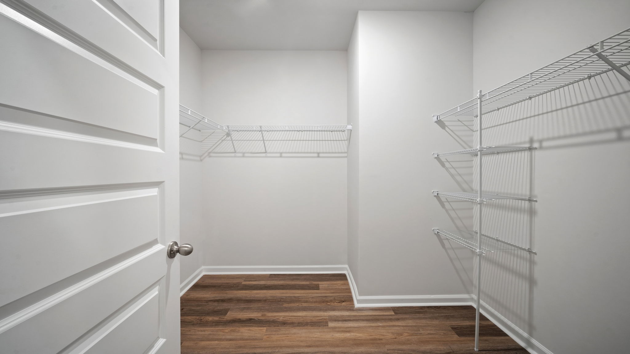 Expansive walk-in closet connected to the primary suite, offering exceptional storage space and organization opportunities.