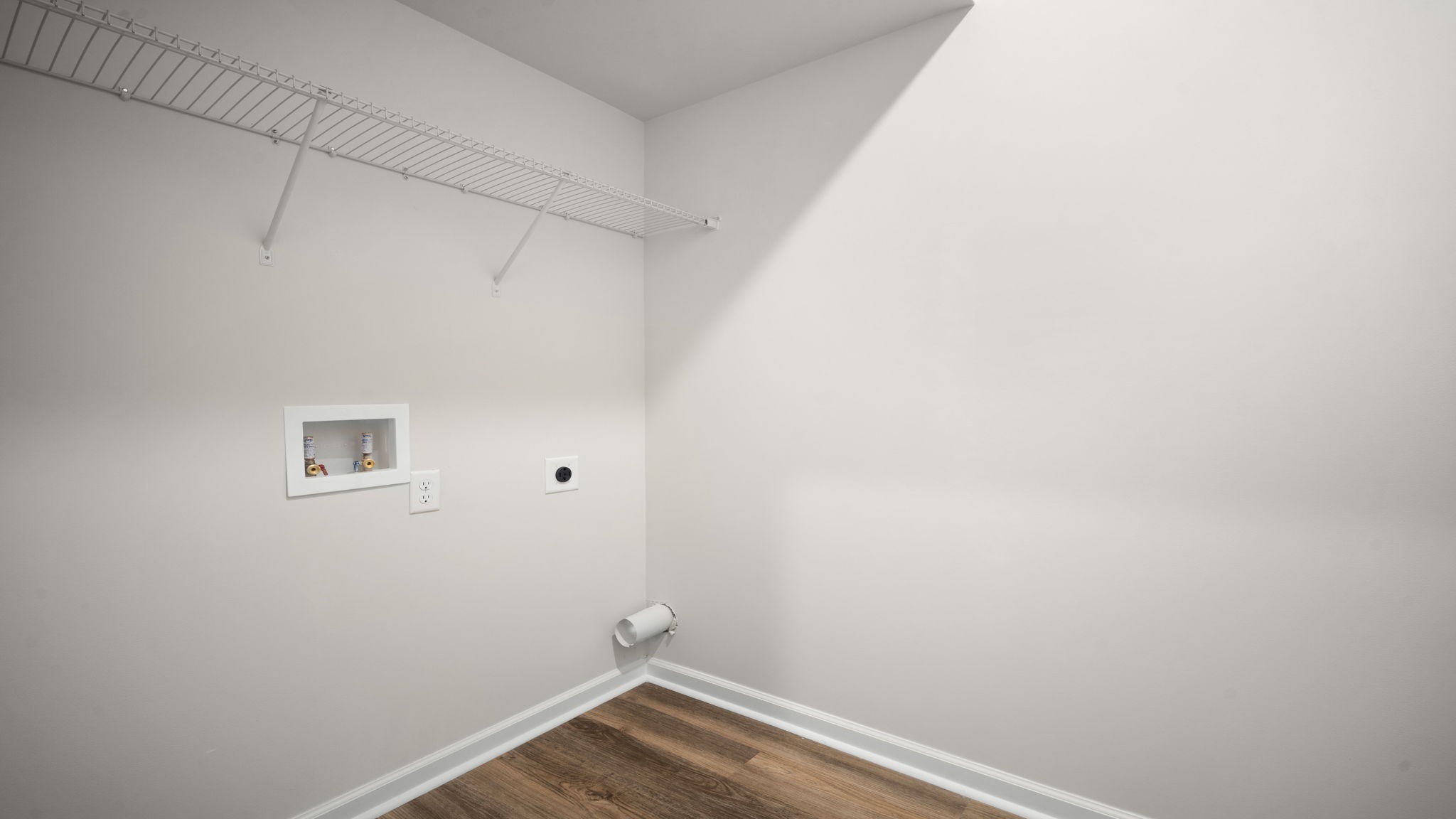 Dedicated laundry room offering practical workspace, storage solutions, and everyday convenience in the Salem floor plan.