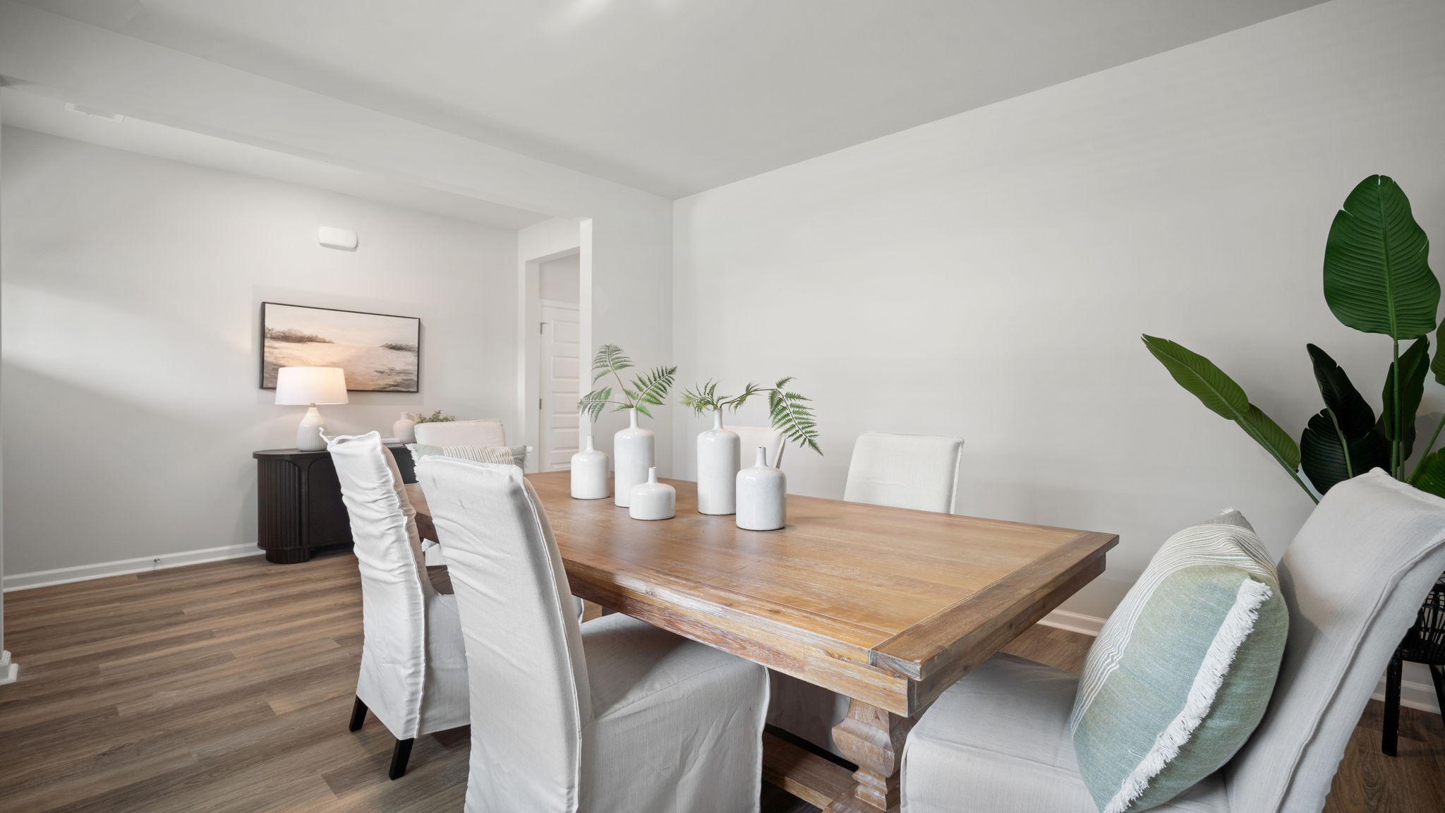 Elegant dining room in the Salem floor plan featuring abundant natural light and effortless connectivity to the gourmet kitchen.