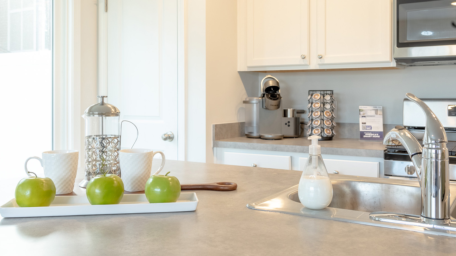 Stylish kitchen in the Duncan floorplan by D.R. Horton featuring designer-inspired finishes, durable countertops, stainless steel appliances, abundant workspace, and a functional layout perfect for modern living.