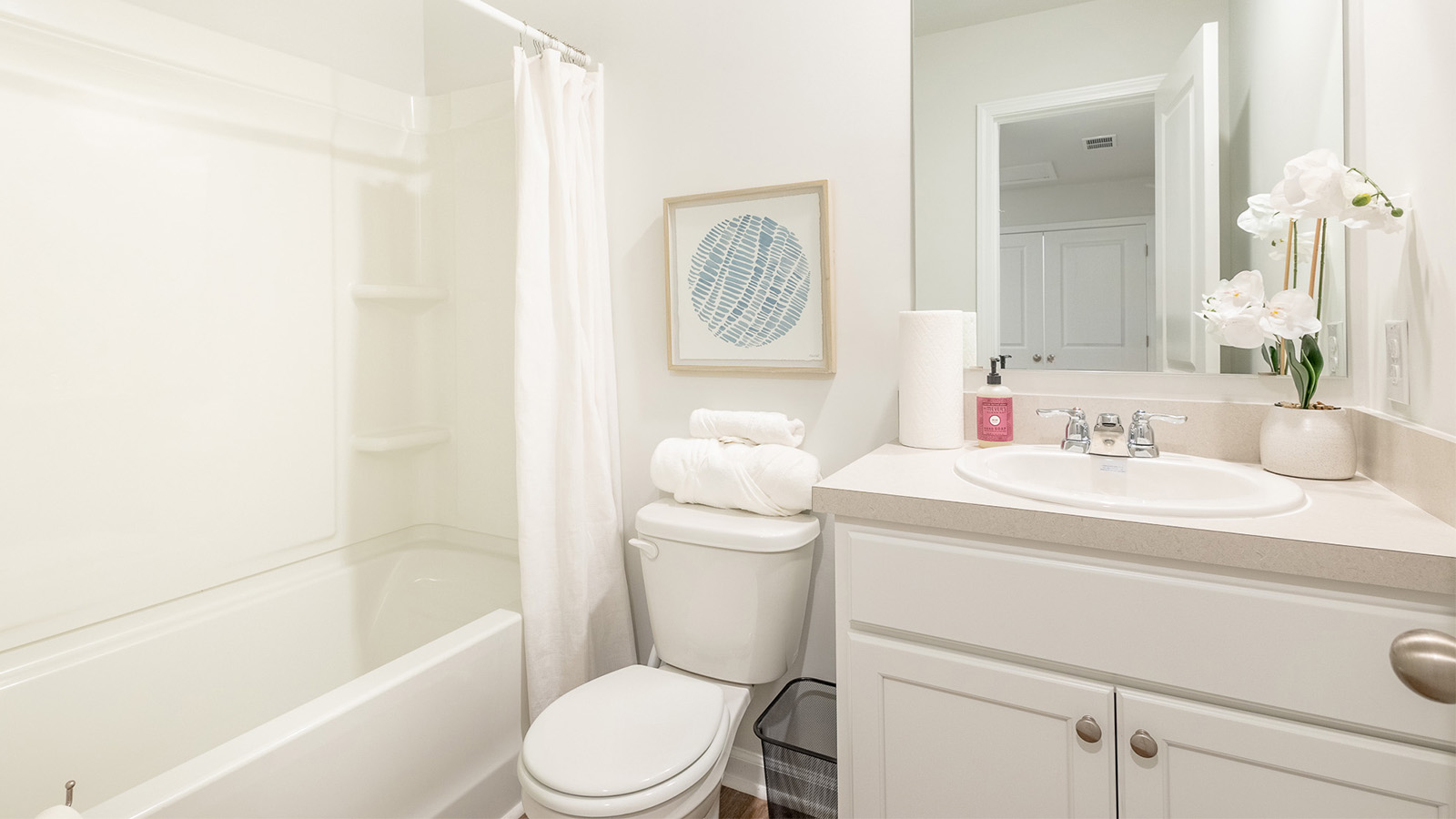 Secondary bathroom in the Duncan townhome at The Towns at Blue Jay showcasing quality craftsmanship and convenient access for guests and residents.