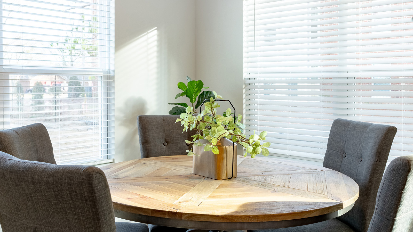 Contemporary dining space in the Duncan townhome showcasing a welcoming atmosphere and functional design ideal for both casual meals and special occasions.