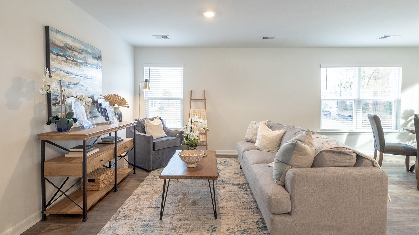 Bright living area in the Duncan by D.R. Horton featuring open sightlines, contemporary style, and comfortable gathering space that enhances the home's functional floorplan.