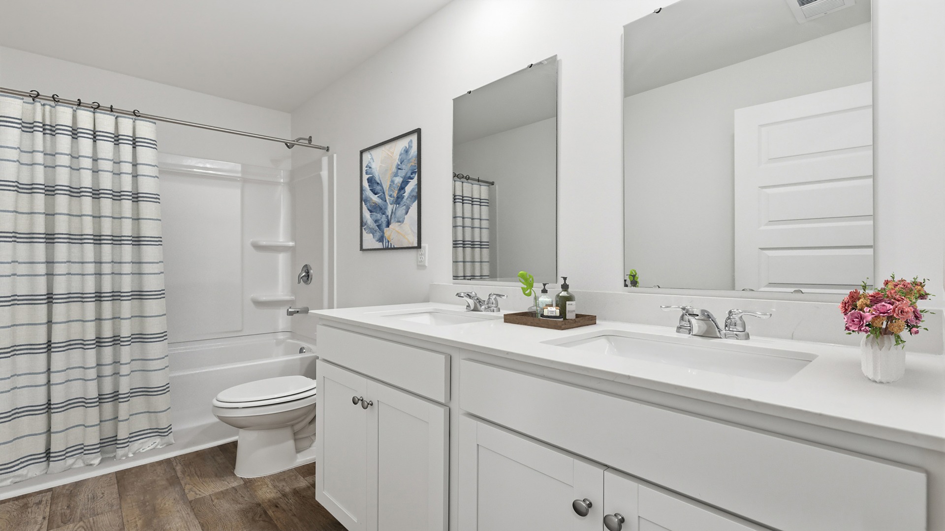 guest bath with double bowl sink and mirror
