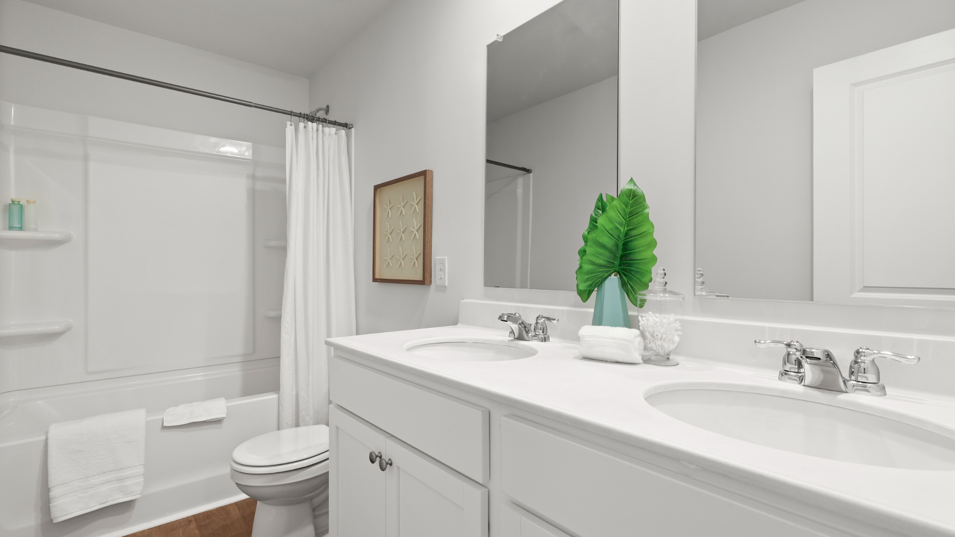 Primary bathroom in the Dillon floorplan by D.R. Horton featuring dual sinks, contemporary fixtures, and a spacious layout designed for everyday convenience.