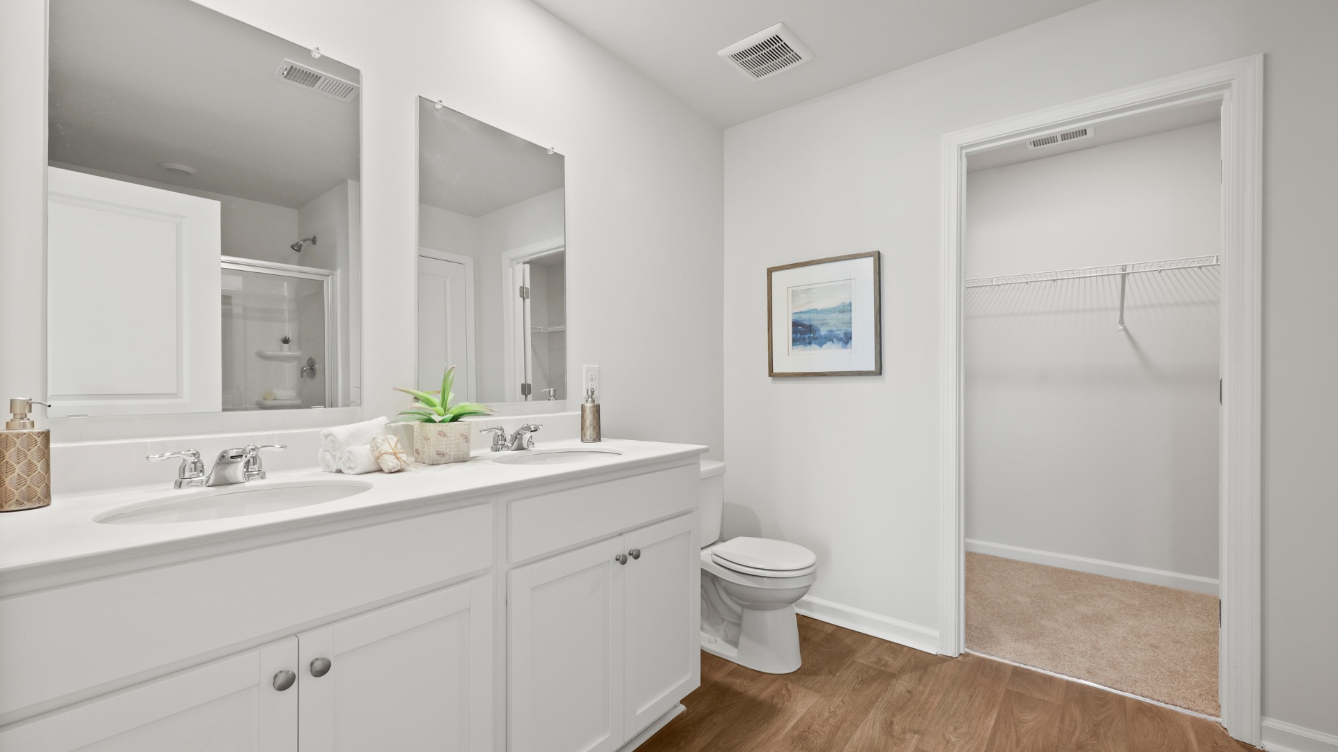 Stylish ensuite bathroom in the Dillon townhome at The Towns at Blue Jay offering modern finishes, ample counter space, and a bright, functional design.