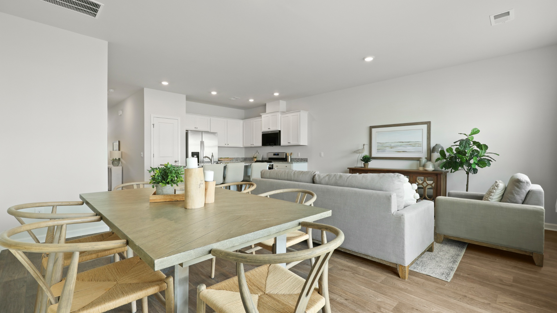 Dining area in the Dillon floorplan by D.R. Horton featuring an open-concept layout with easy access to the kitchen and living room, creating an ideal space for gatherings and meals.