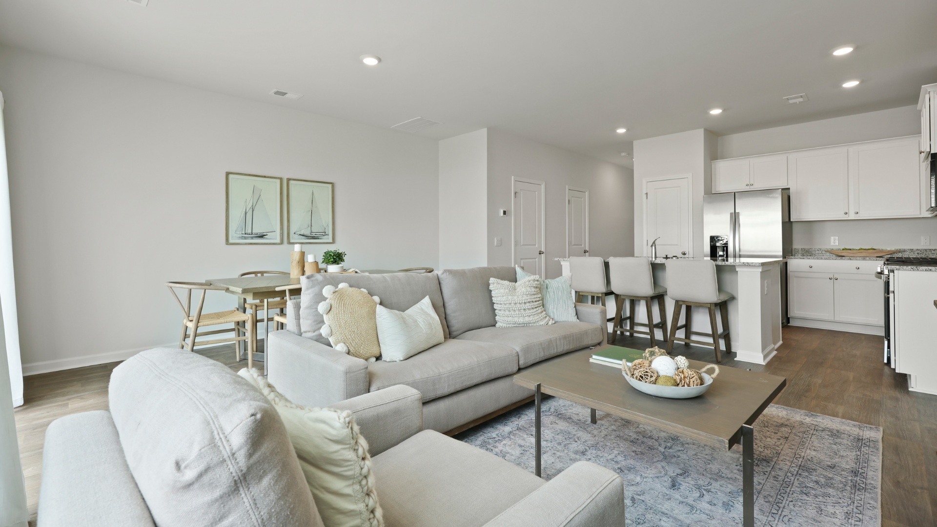 Inviting living area in the Dillon townhome at The Towns at Blue Jay offering a bright, airy layout perfect for relaxing, entertaining, and modern coastal Georgia living.