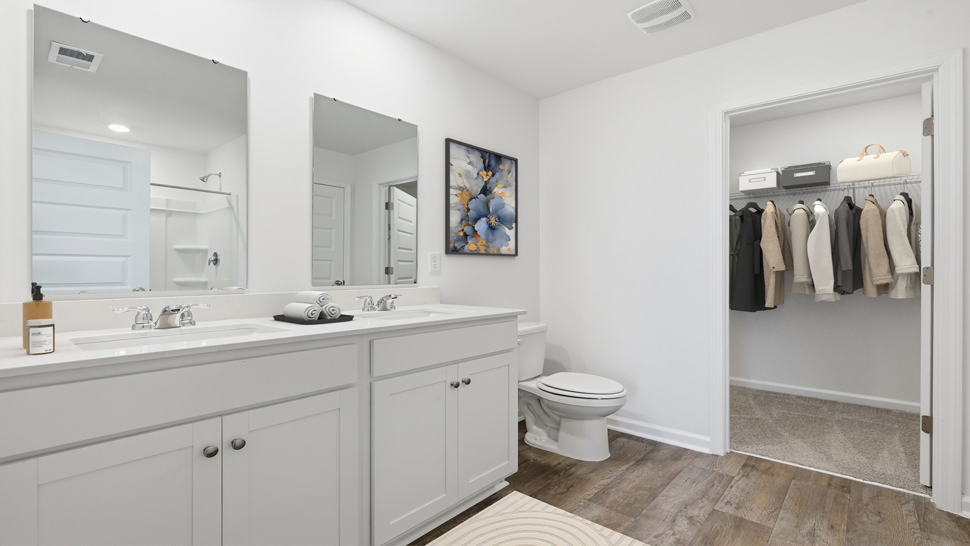 primary bath with double sinks and mirro