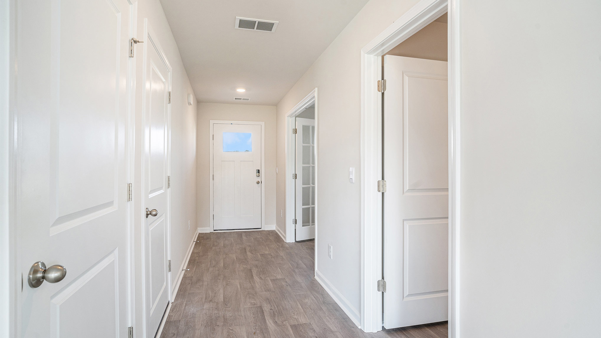 entryway with white door